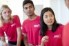 three undergrad students in red shirts