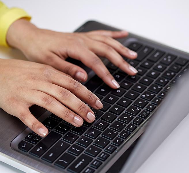teen hands on a computer keyboard