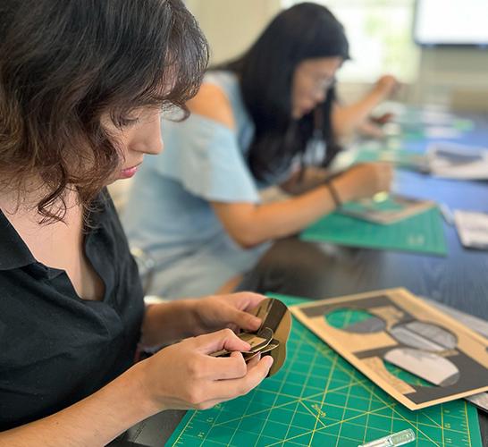 Students cutting wood 