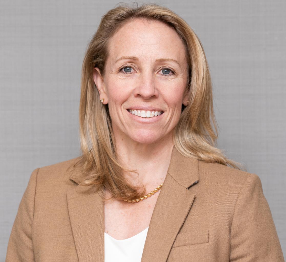 woman in a tan blazer