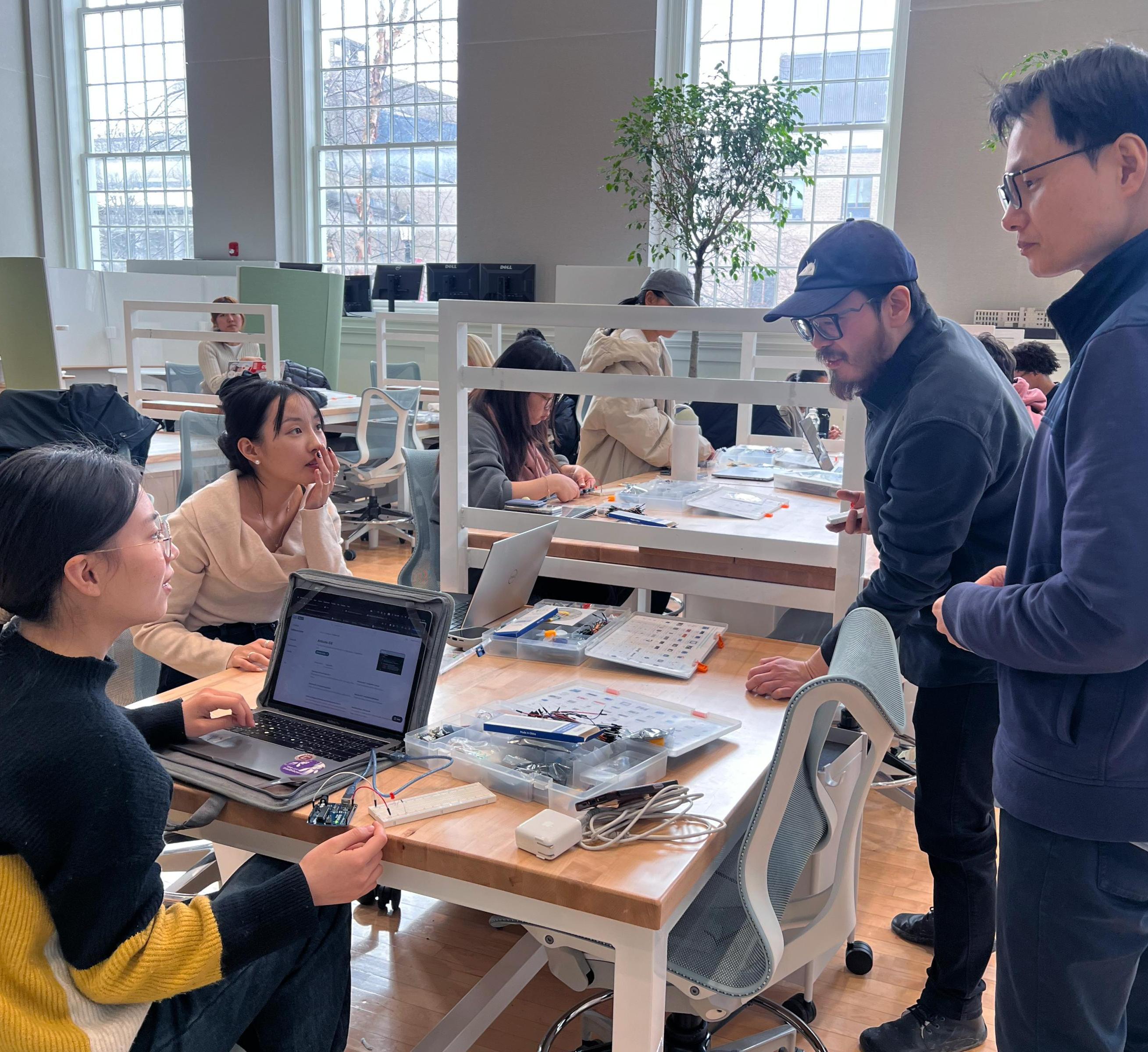 students and faculty work on designs in MVR 1101