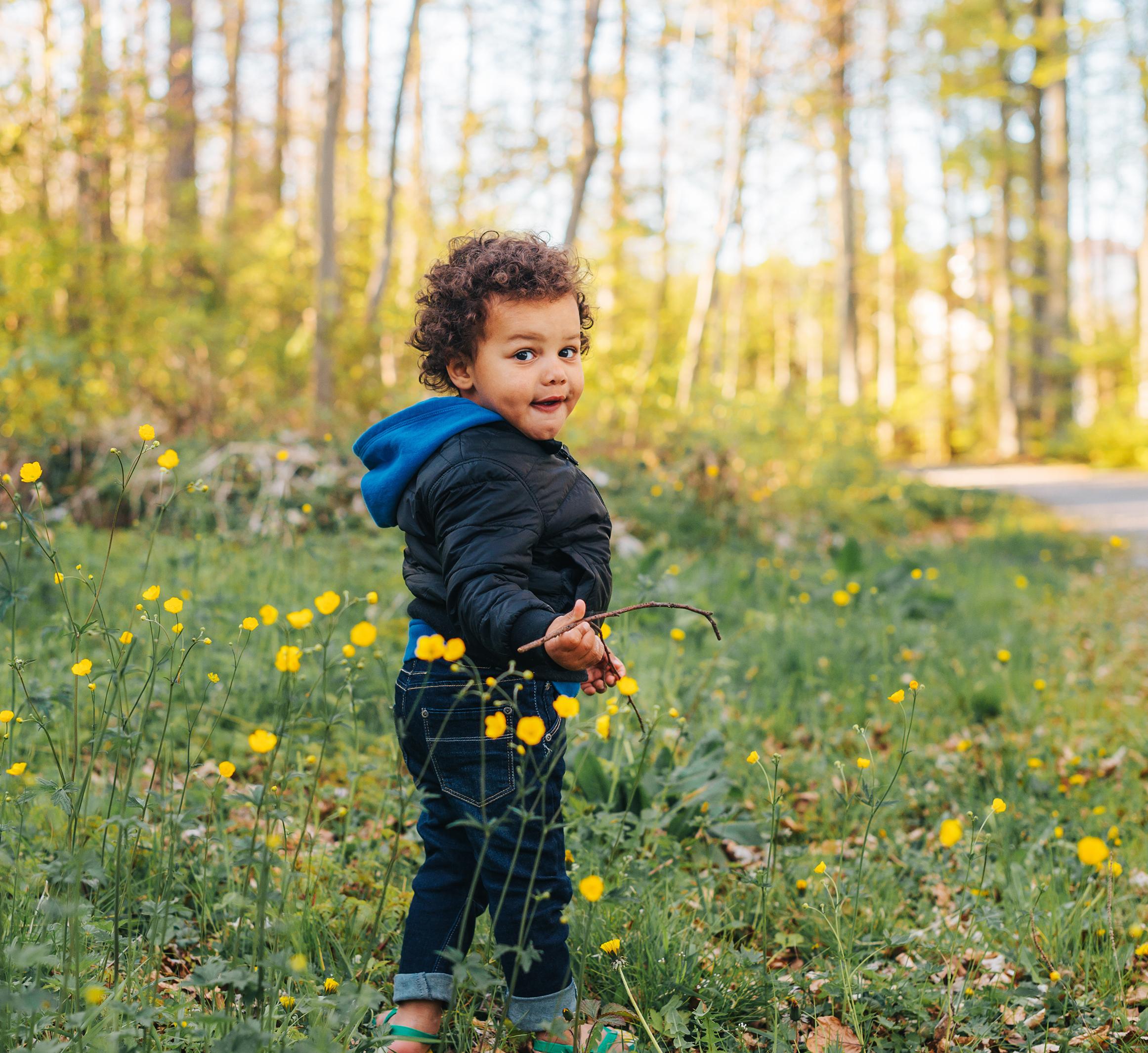 toddler on a wooded trail