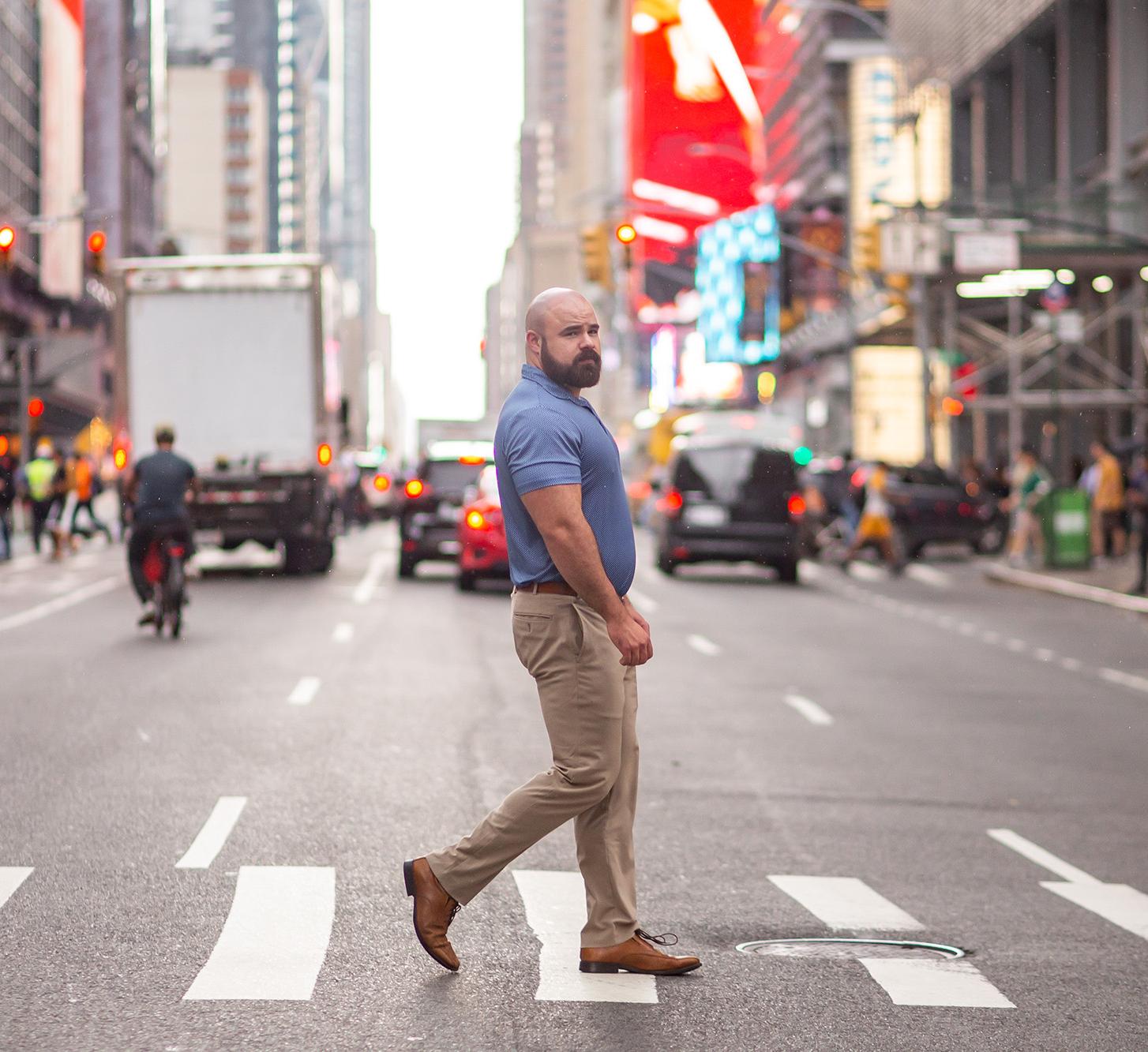 Adam Hoffman walks across the street in NYC