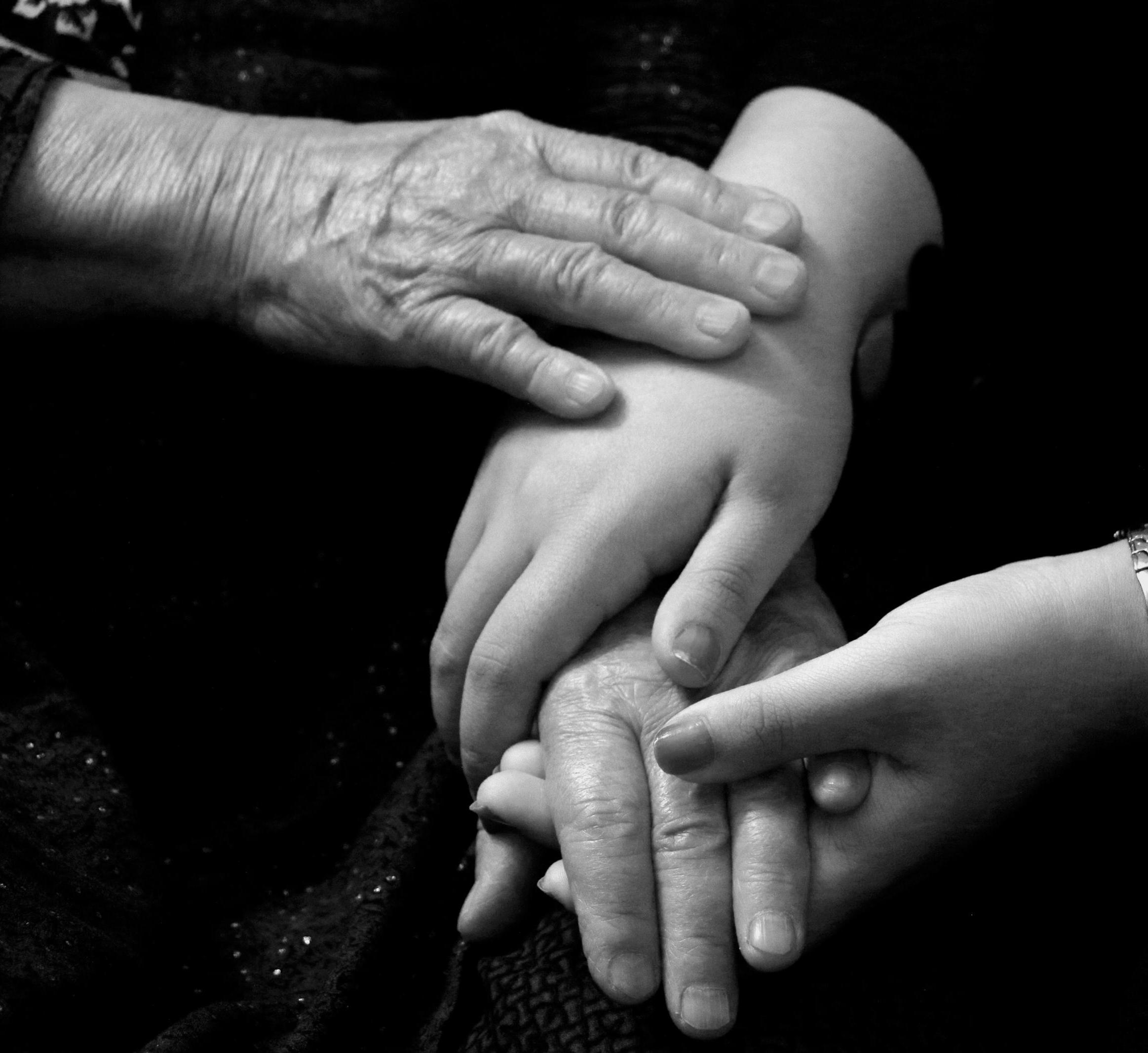 image of younger person helping an older person