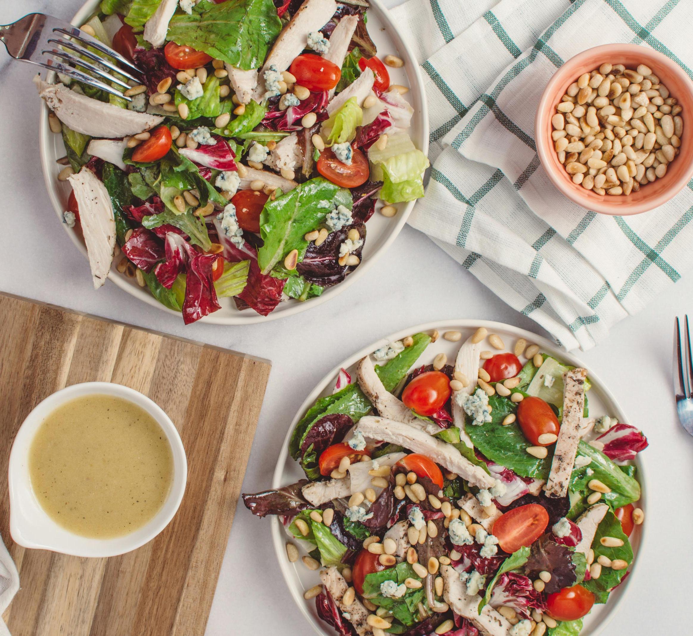 Mediterranean salad with pine nuts, vegetables and chicken