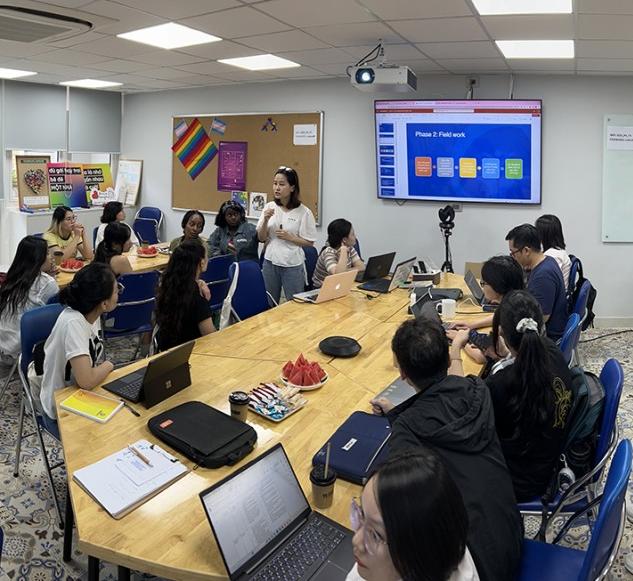 SCDI’s Trang Minh Nguyen, program manager for harm reduction and addiction treatment and children and youth programs, speaks to the team in preparation for work with VACEP storytelling partners in the SCDI offices in Hanoi.