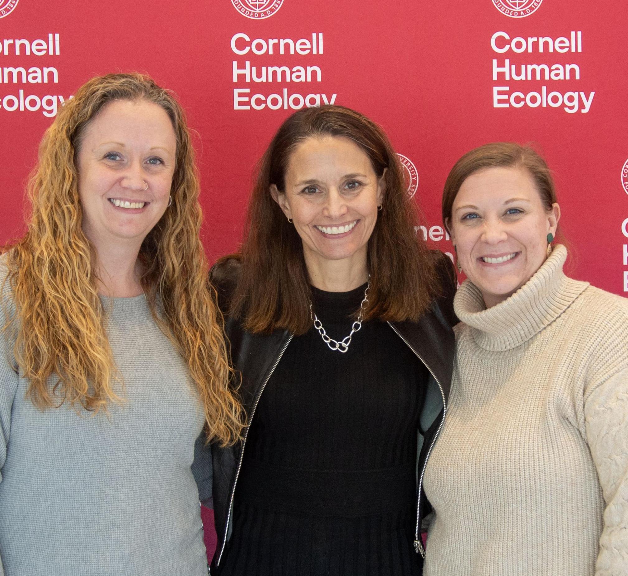 2025's two staff award winners with Dean Rachel Dunifon.