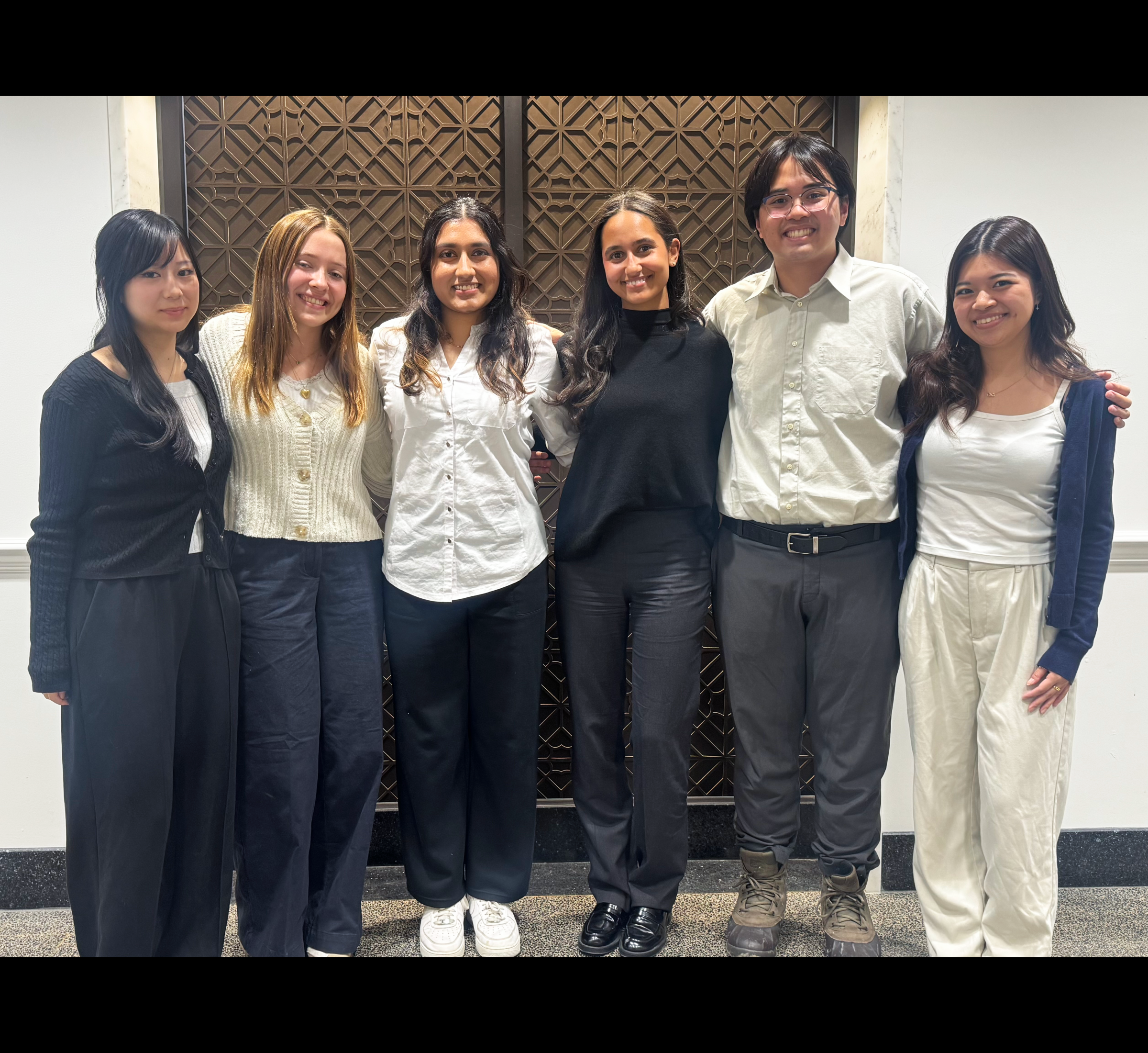 six students pose for a photo