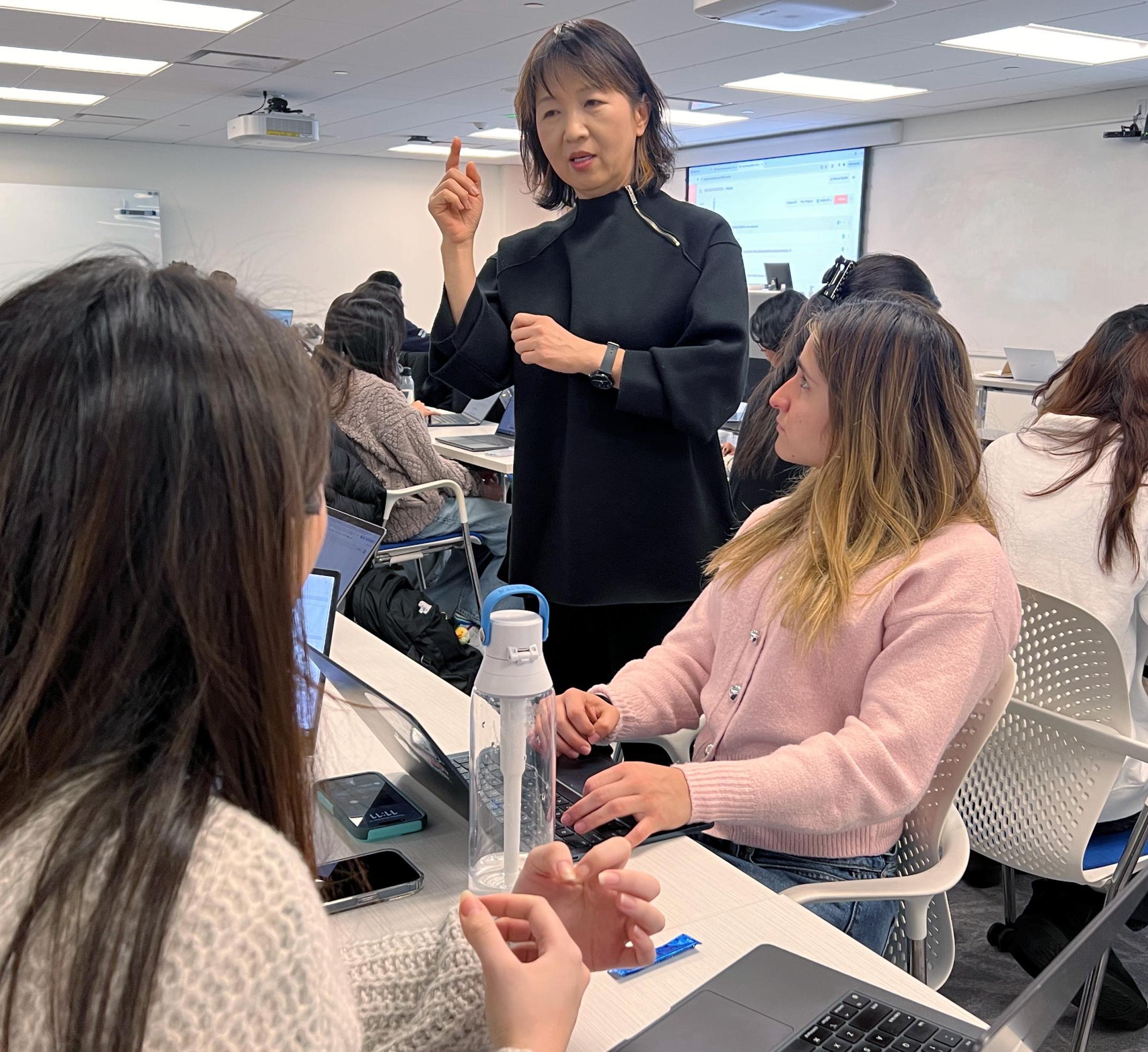 So-Yeon works with students during design time in class