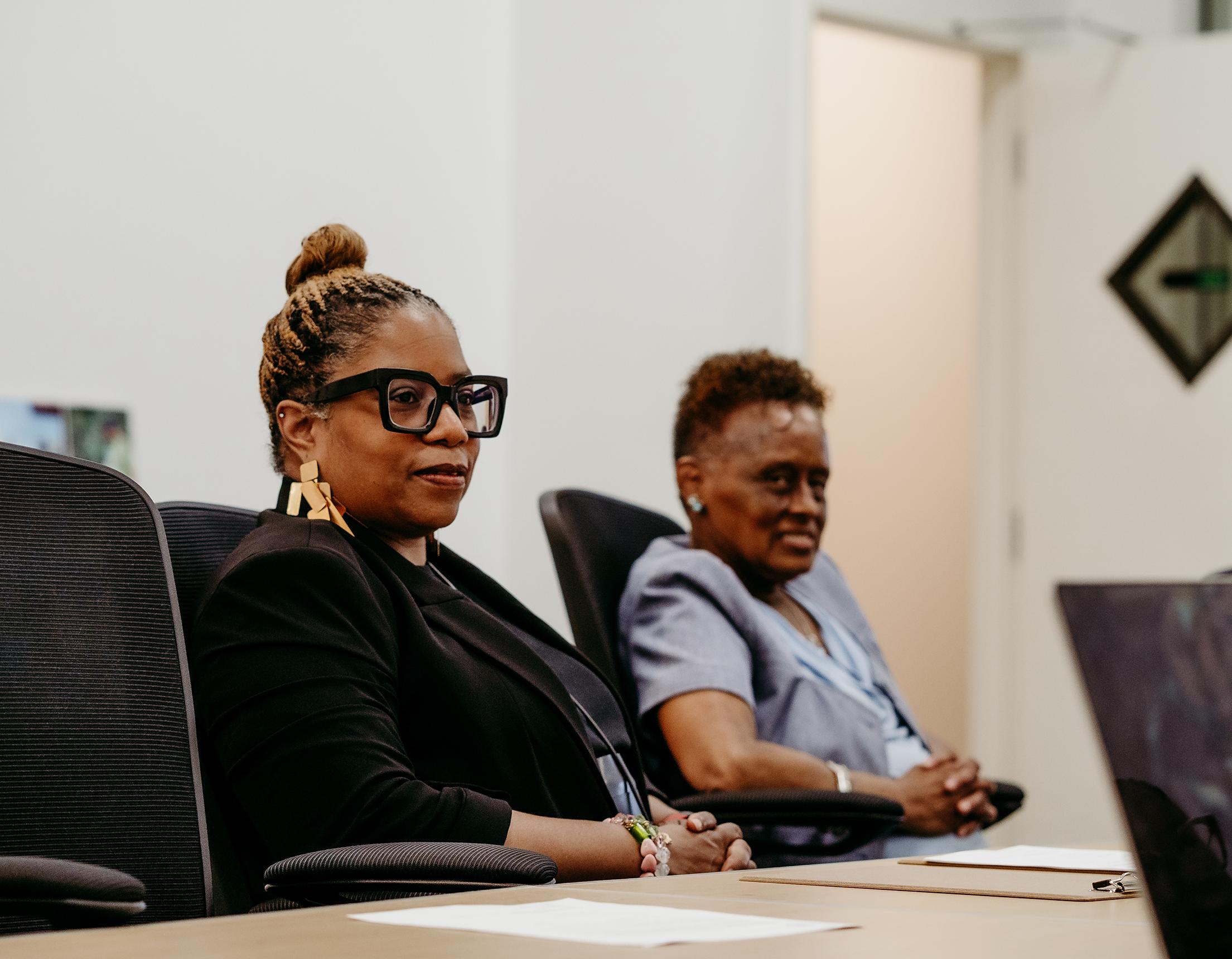women sitting at a conference table