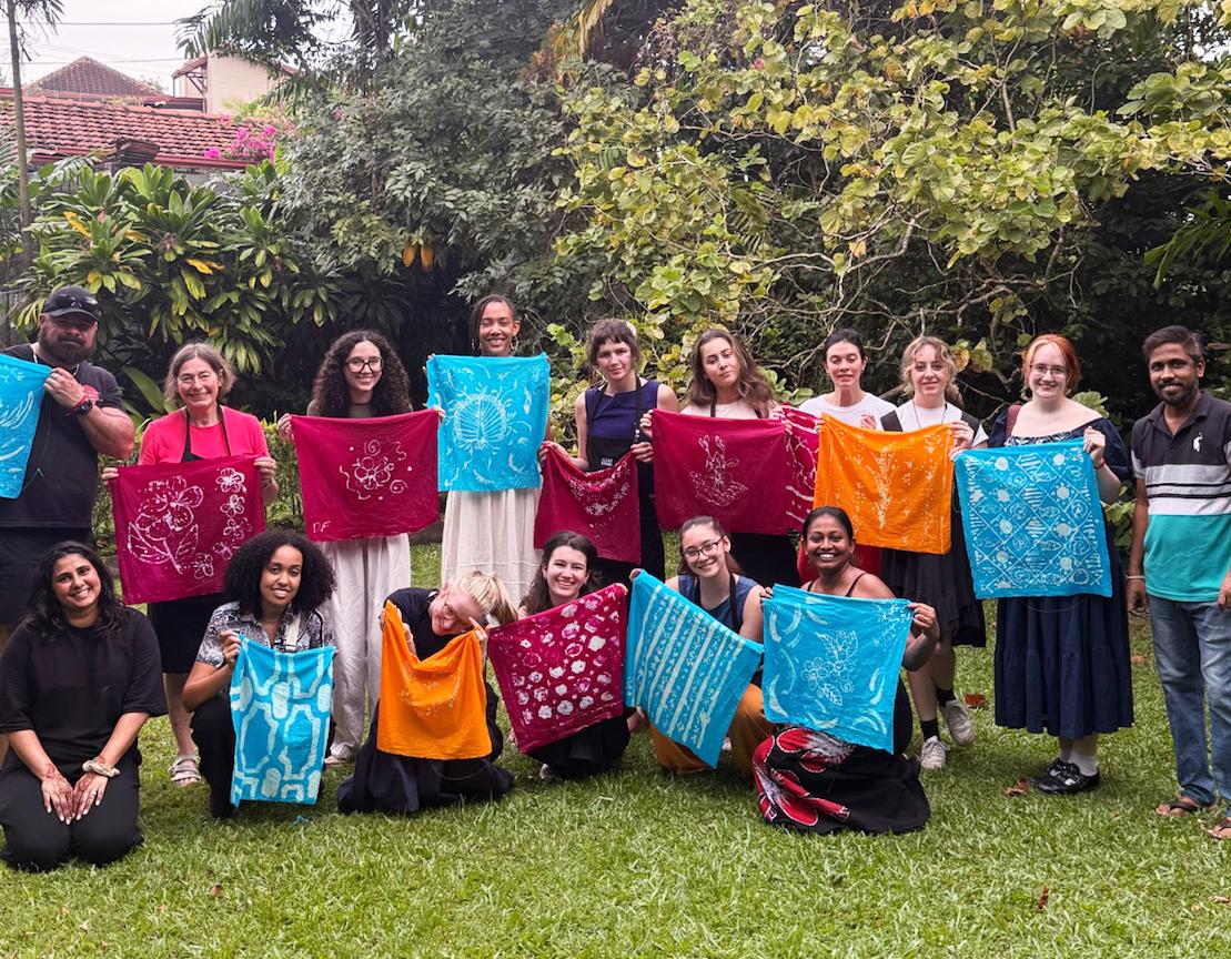 Photo of group displaying their batik work
