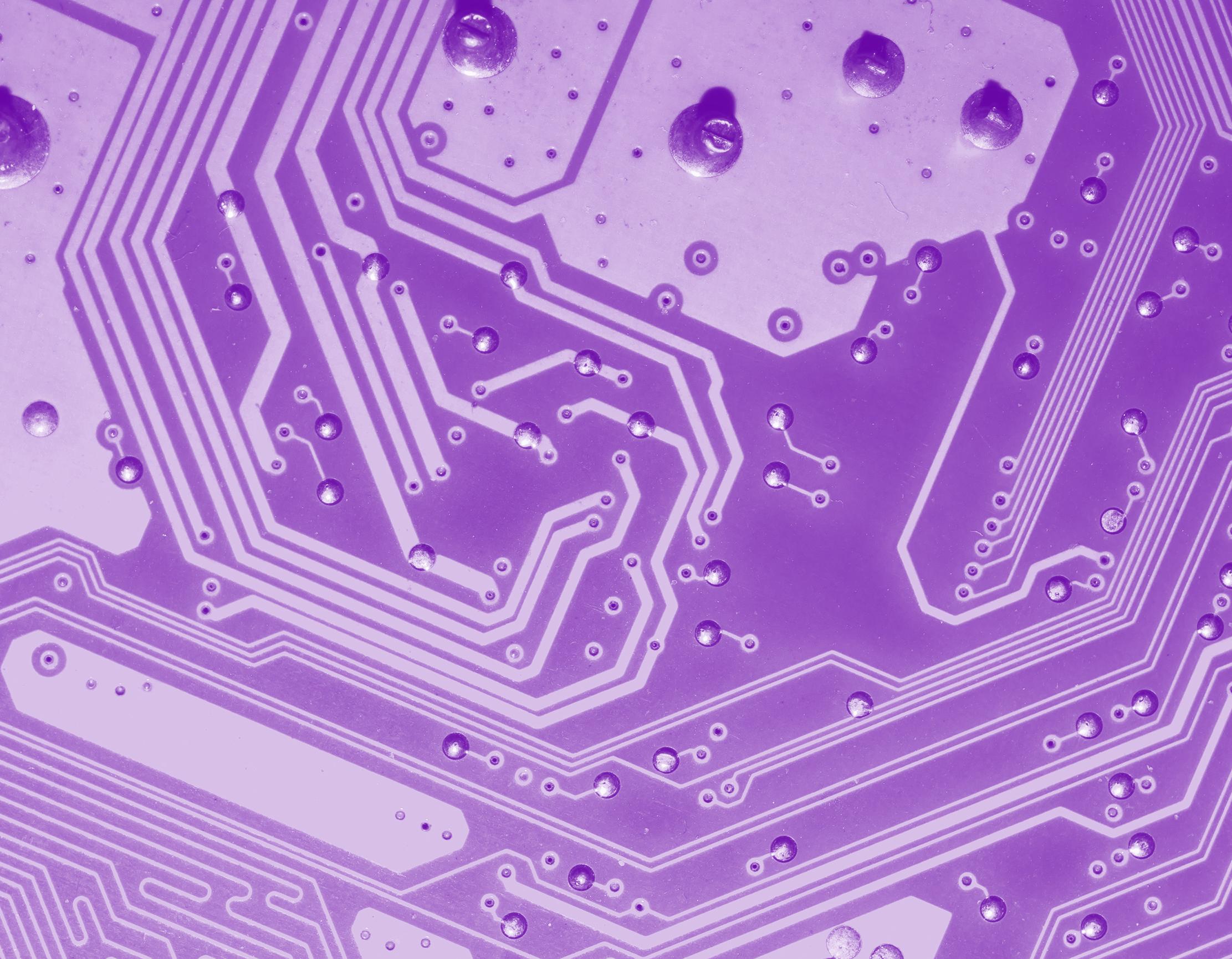 purple tinted image of a computer board