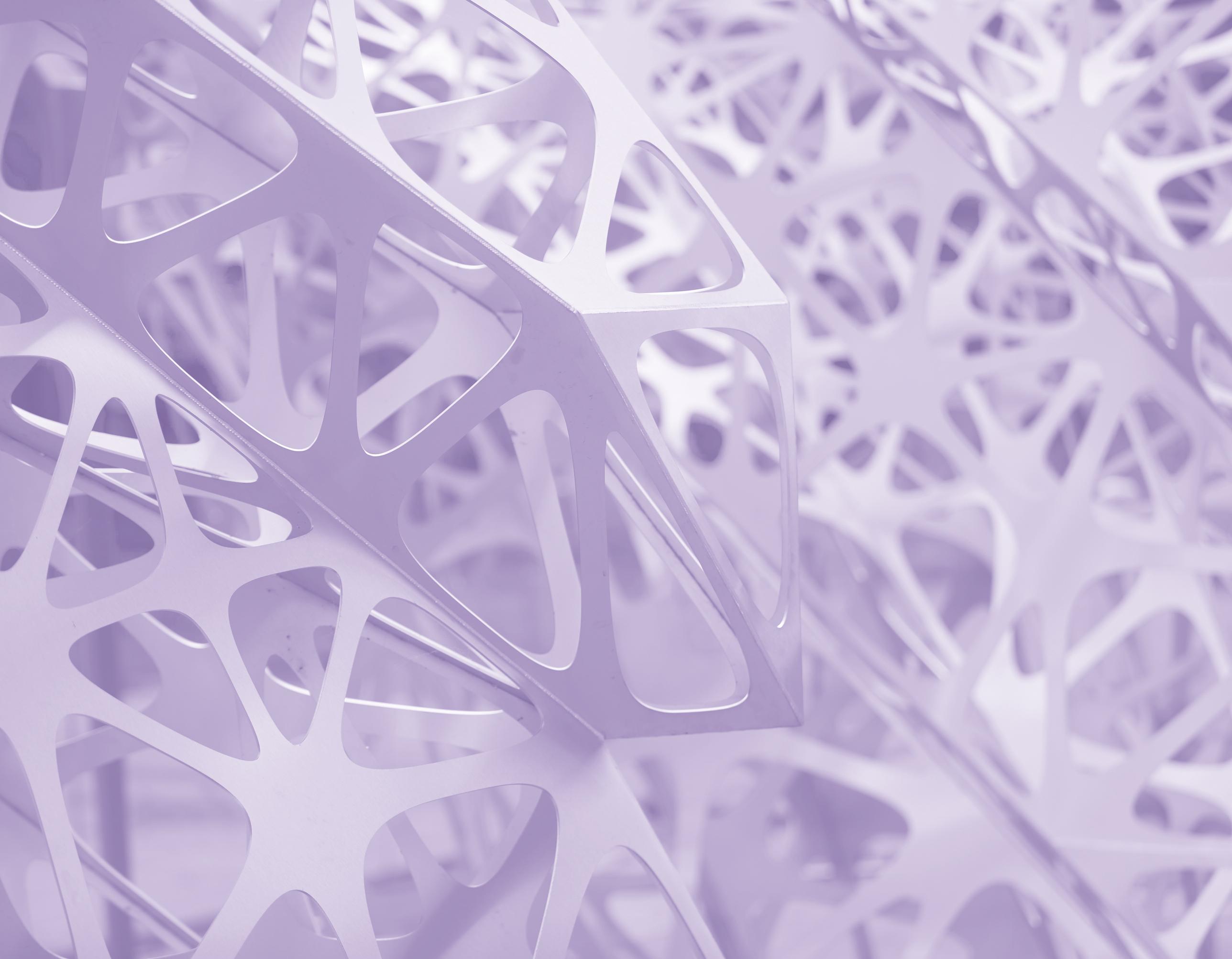 close up of a metal sculpture tinted purple