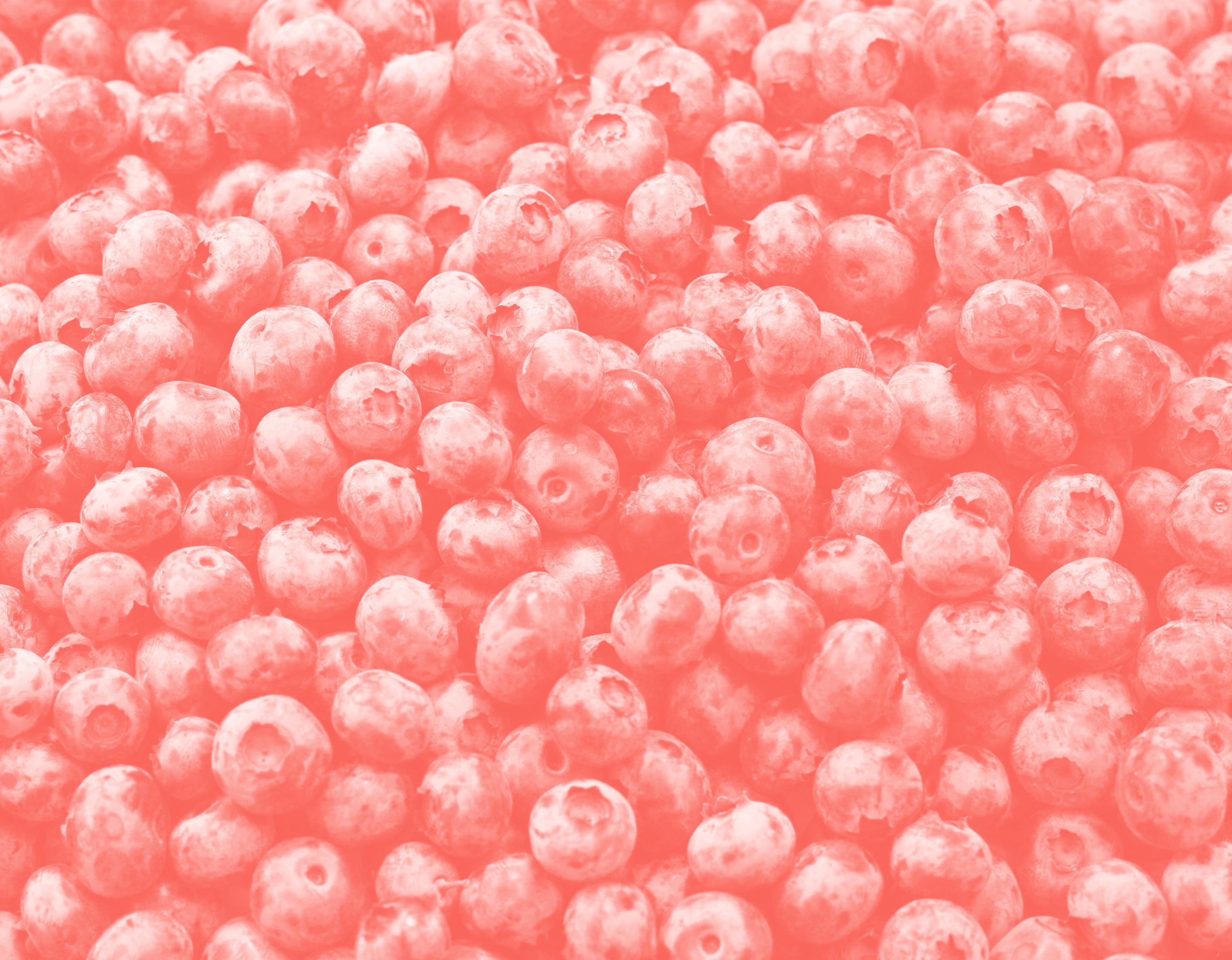 red tinted image of blueberries