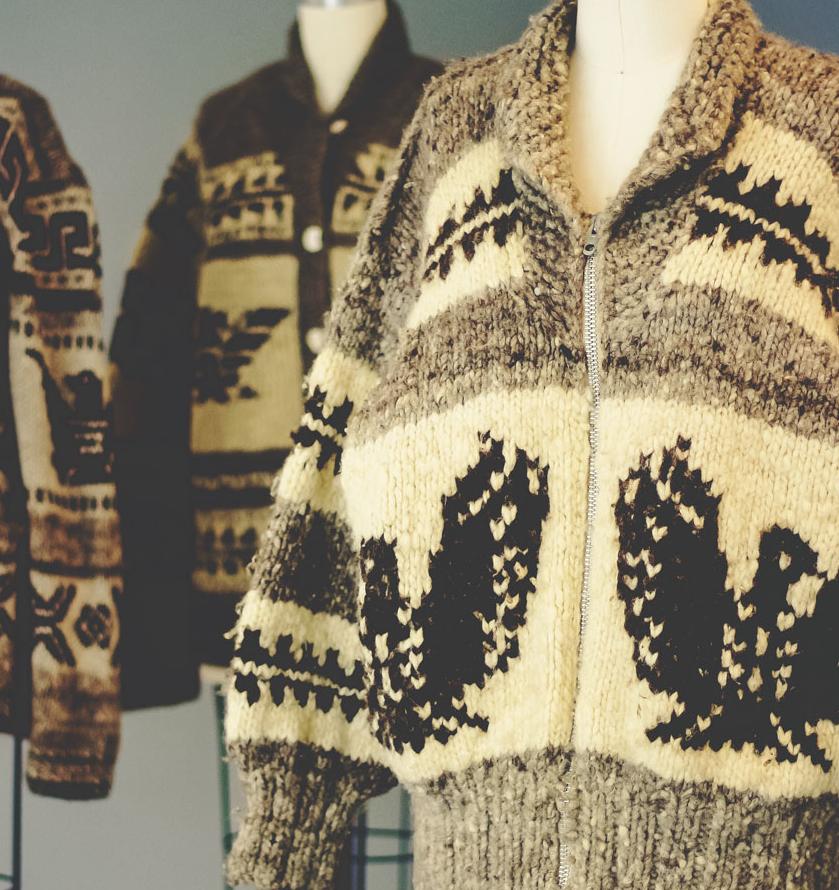 three heavy knit cowl neck zip sweaters on mannequins