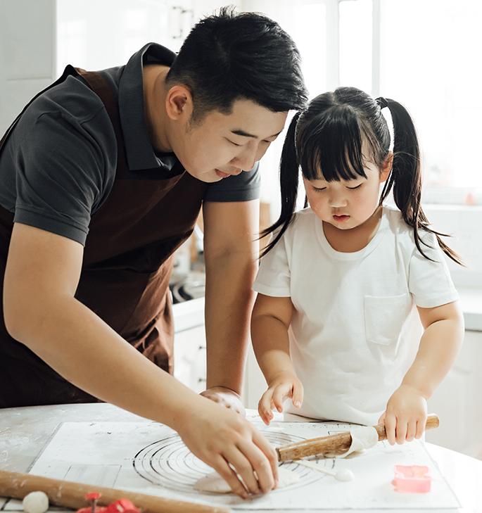 father and daughter baking