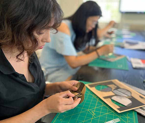 Students cutting wood 