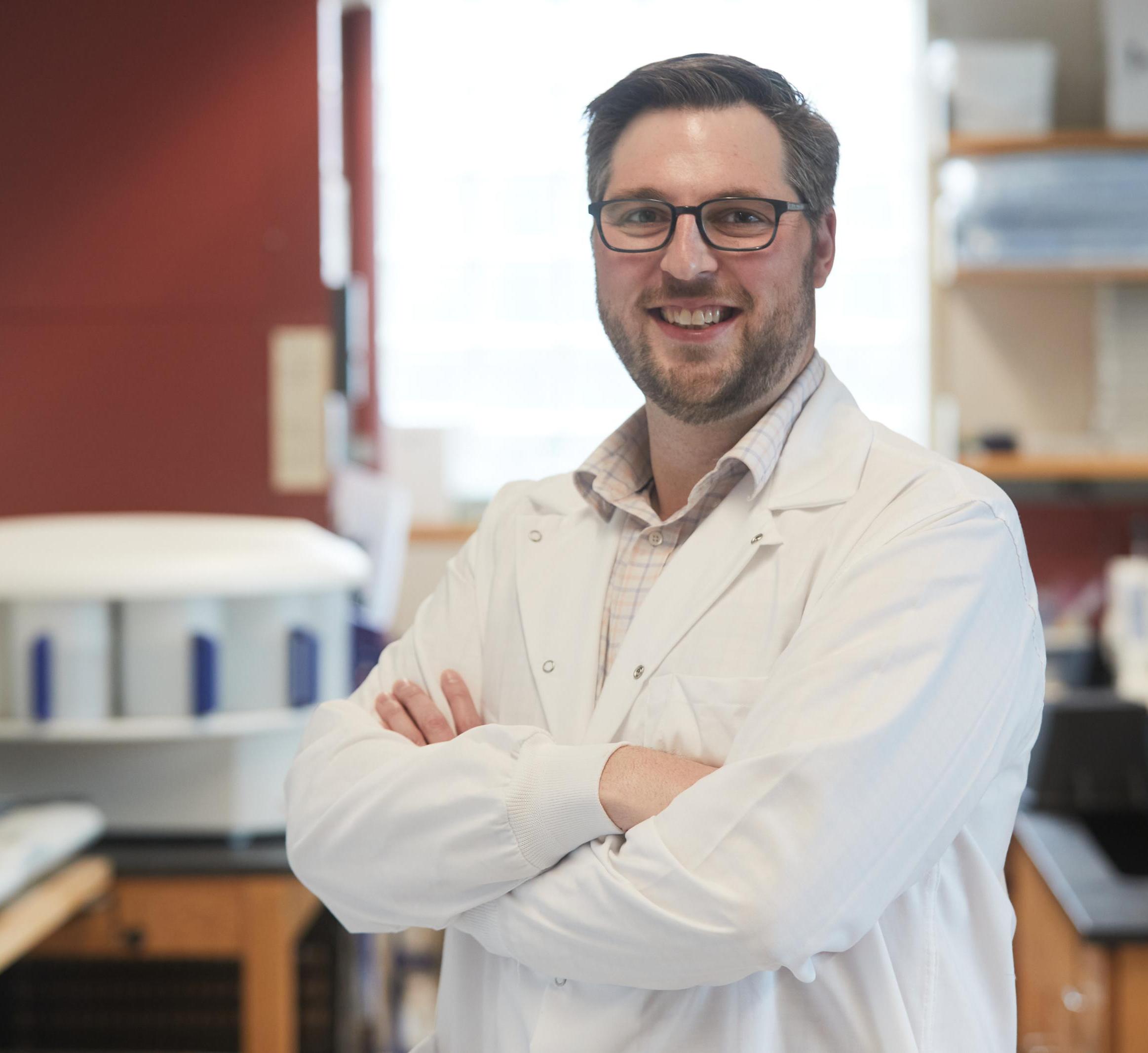 Dan Berry wearing a lab coat 