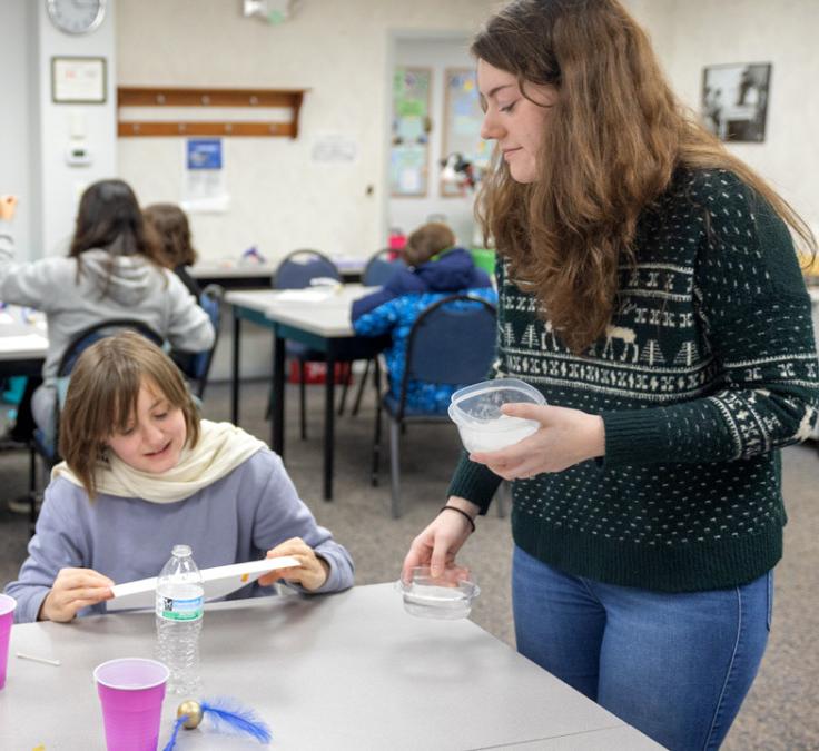 Gabrielle Dion, 4-H CARE wellness educator at Cornell Cooperative Extension Jefferson County, leads a group of students in a STEM activity