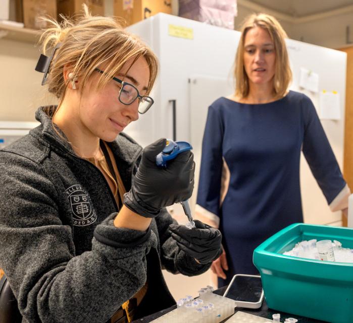Grad student and Martha Field in lab