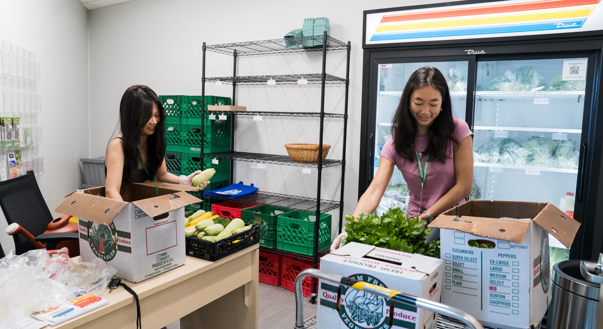 Two students help pack boxes