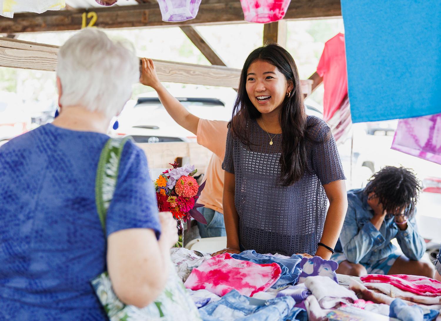 A student in the BCTR Scholars Program works at the Artists Market