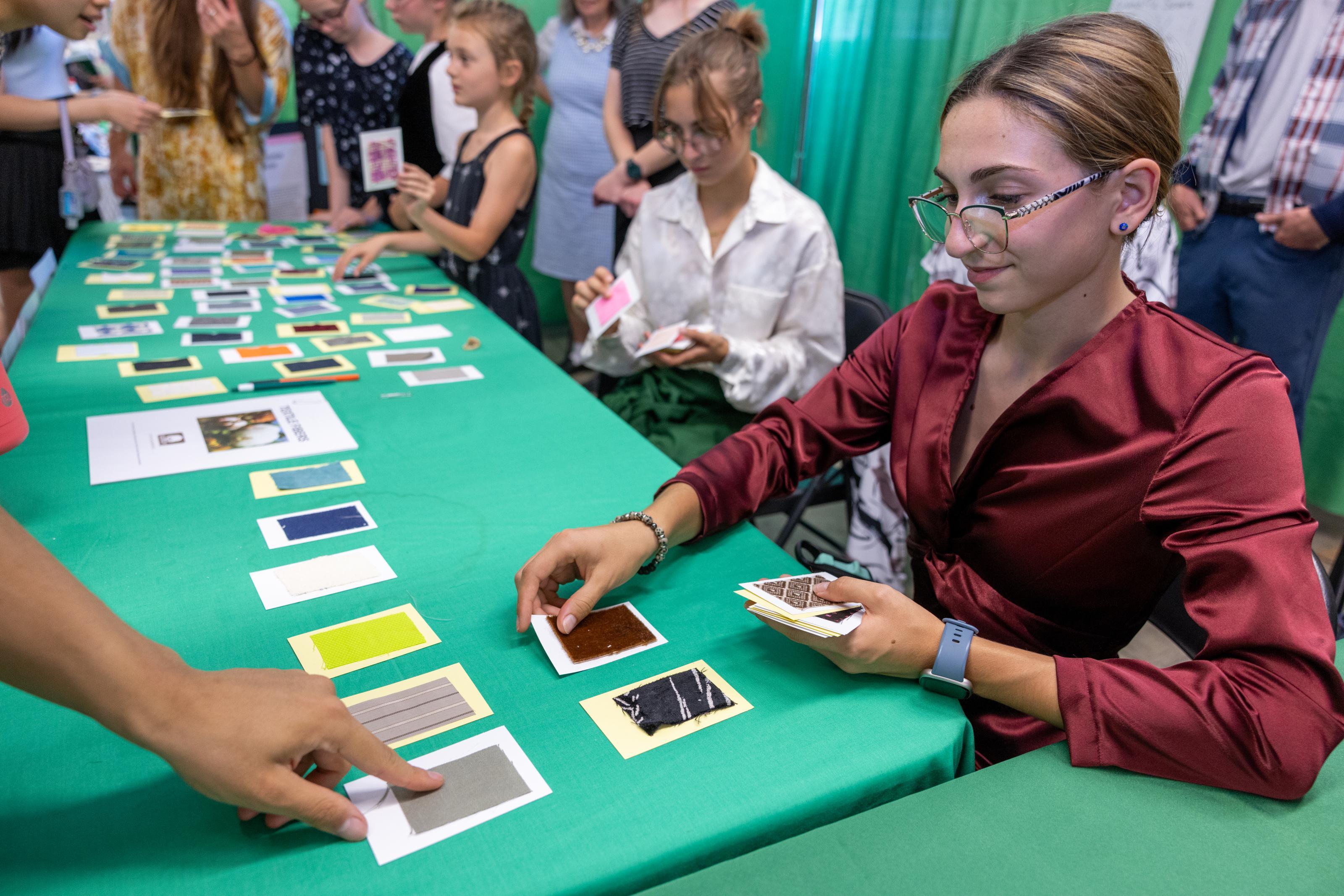 Fabric samples on a green background