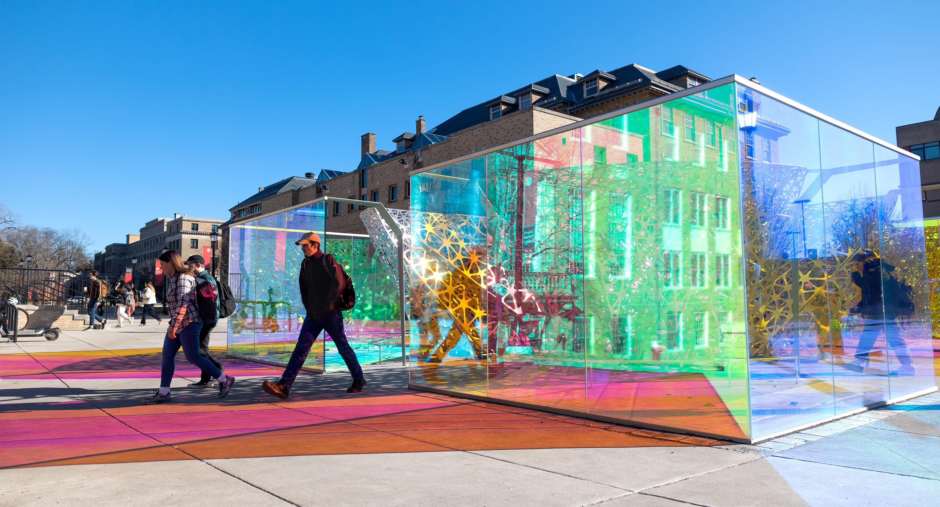 metal and glass outdoor sculpture on a college campus