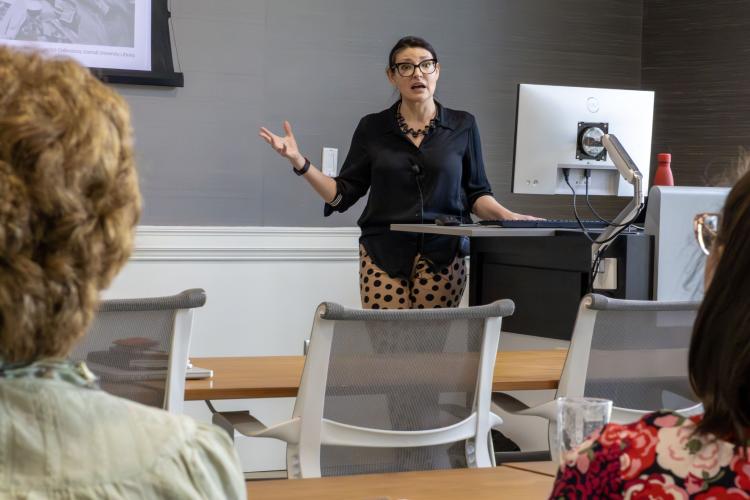 Tara Pearson presents her research findings to an audience