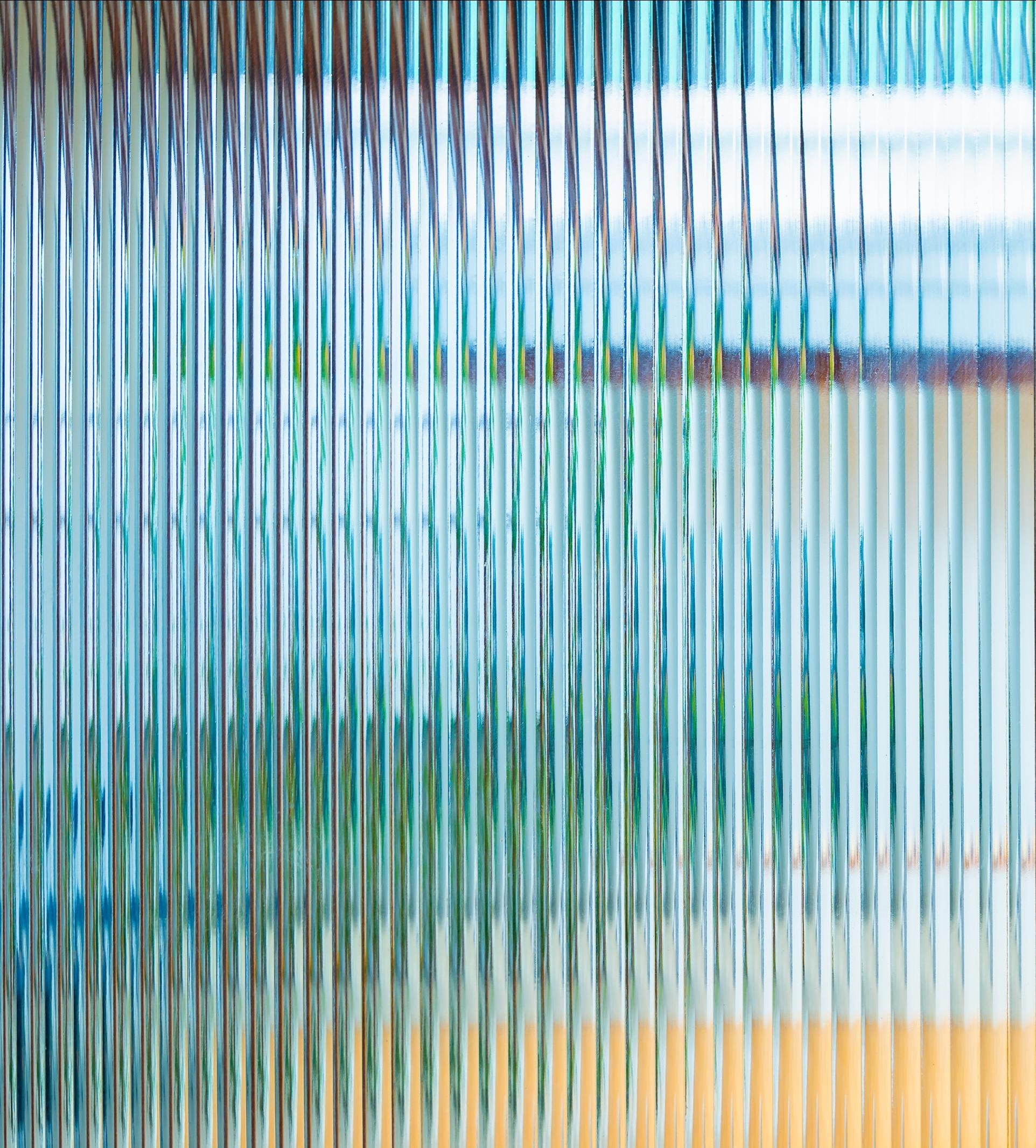abstract of ridged glass with blue and yellow tones