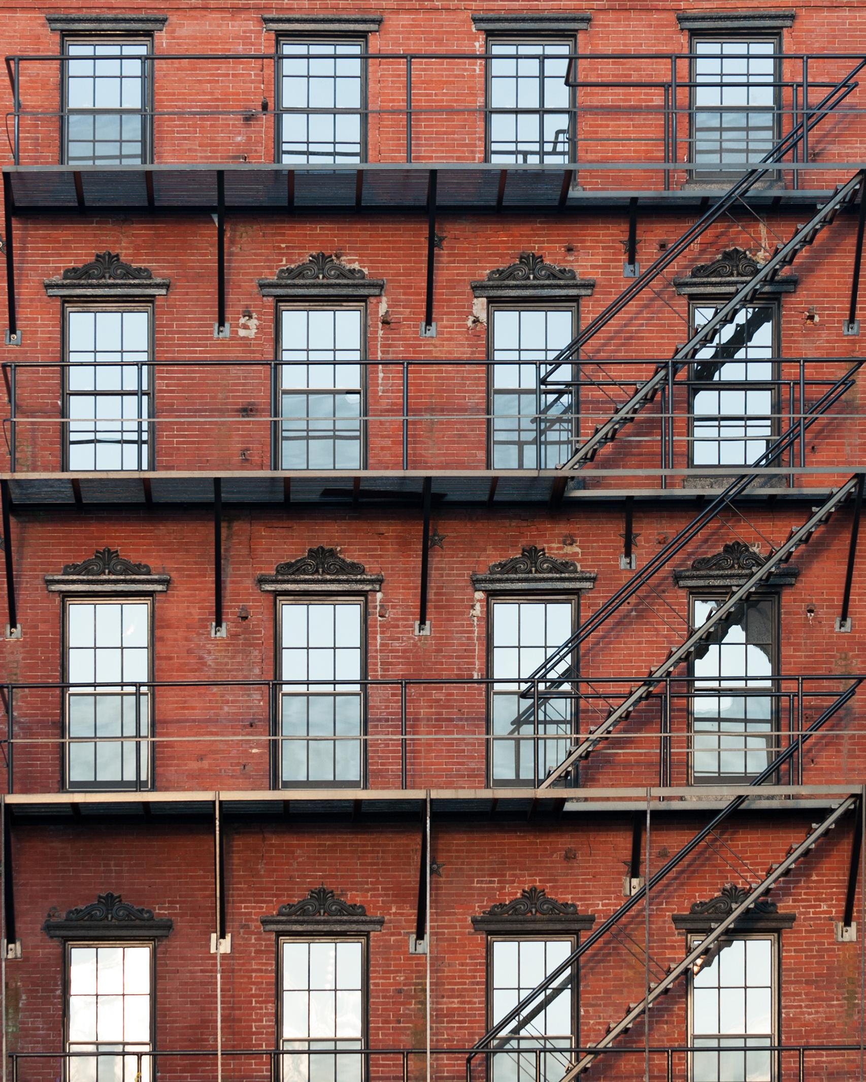 red brick residential apartment building facade