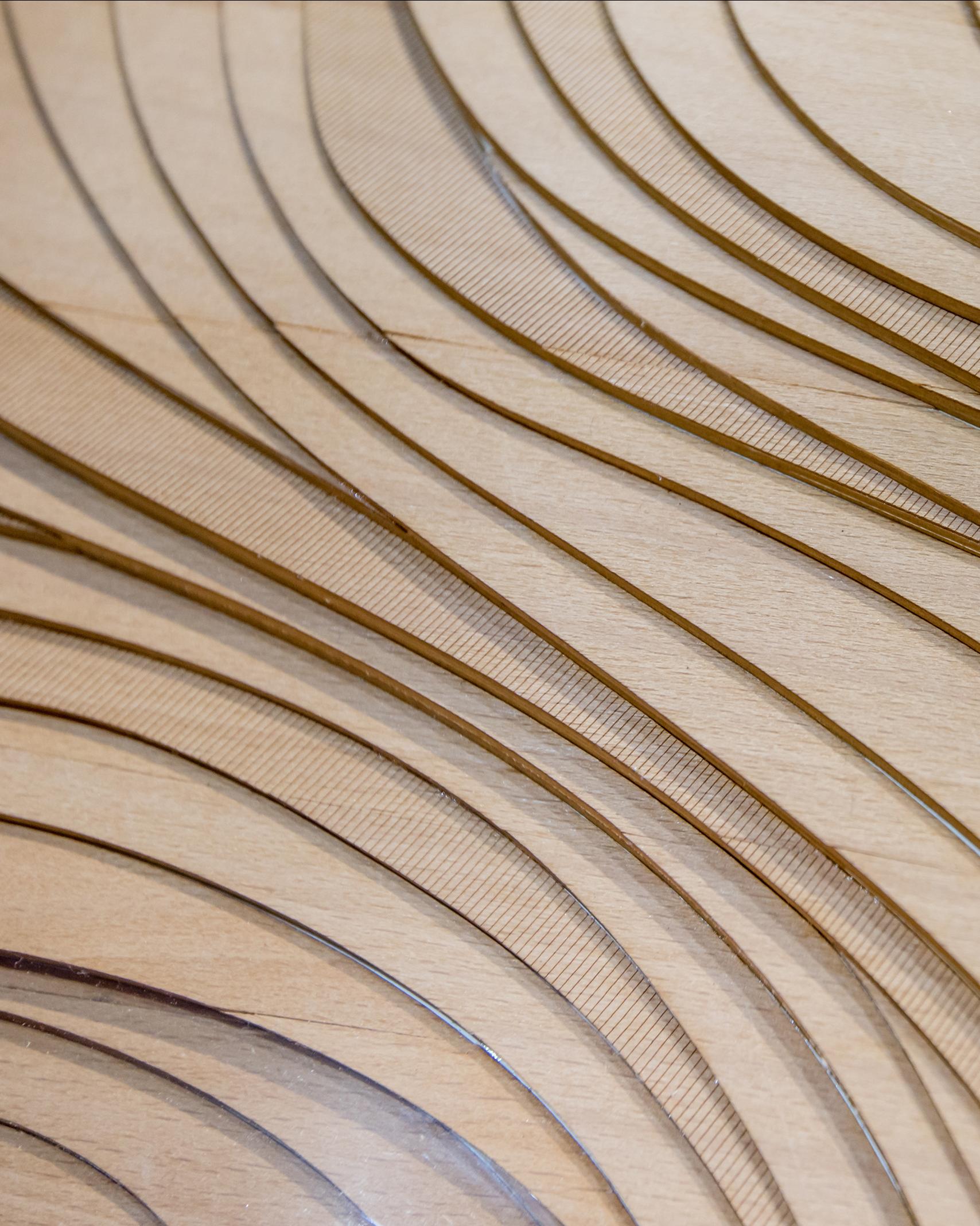 close up of wood cut in wave patterns