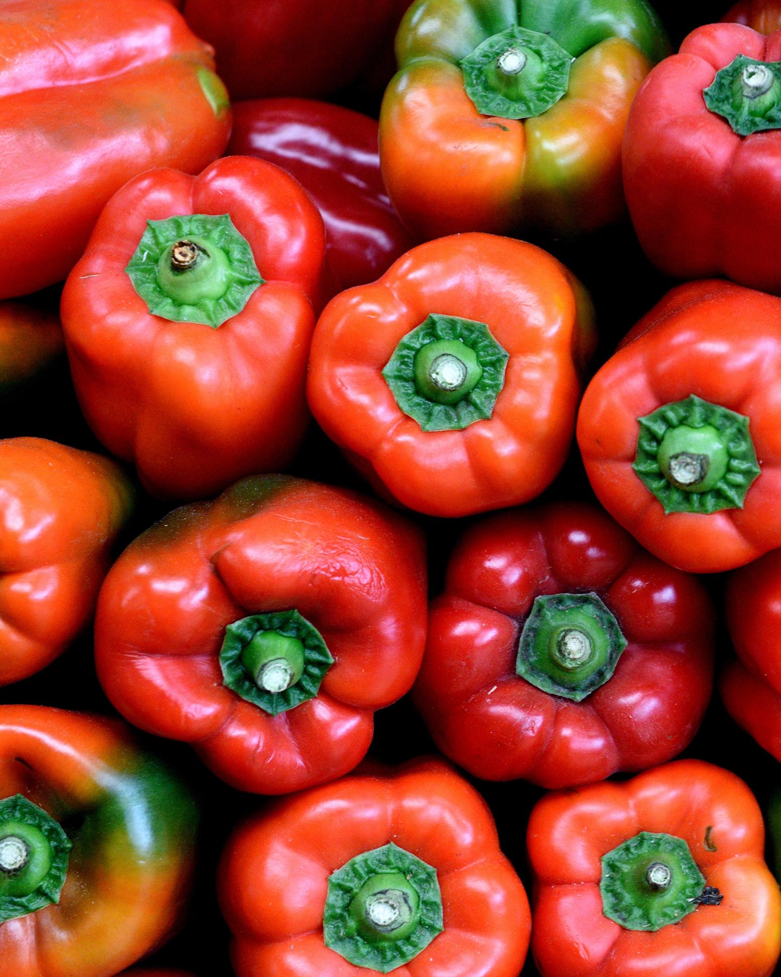 close up of a pile of red peppers