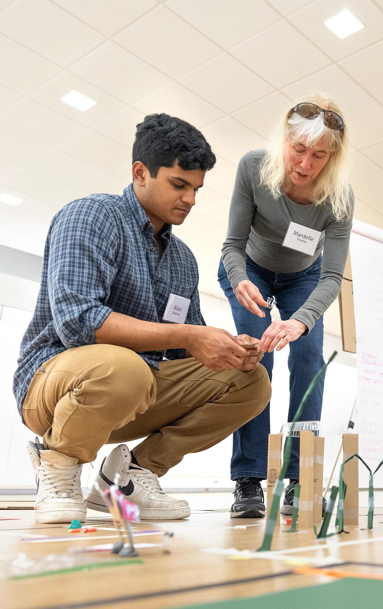 Mardelle Shepley works with a group to design a prototype 