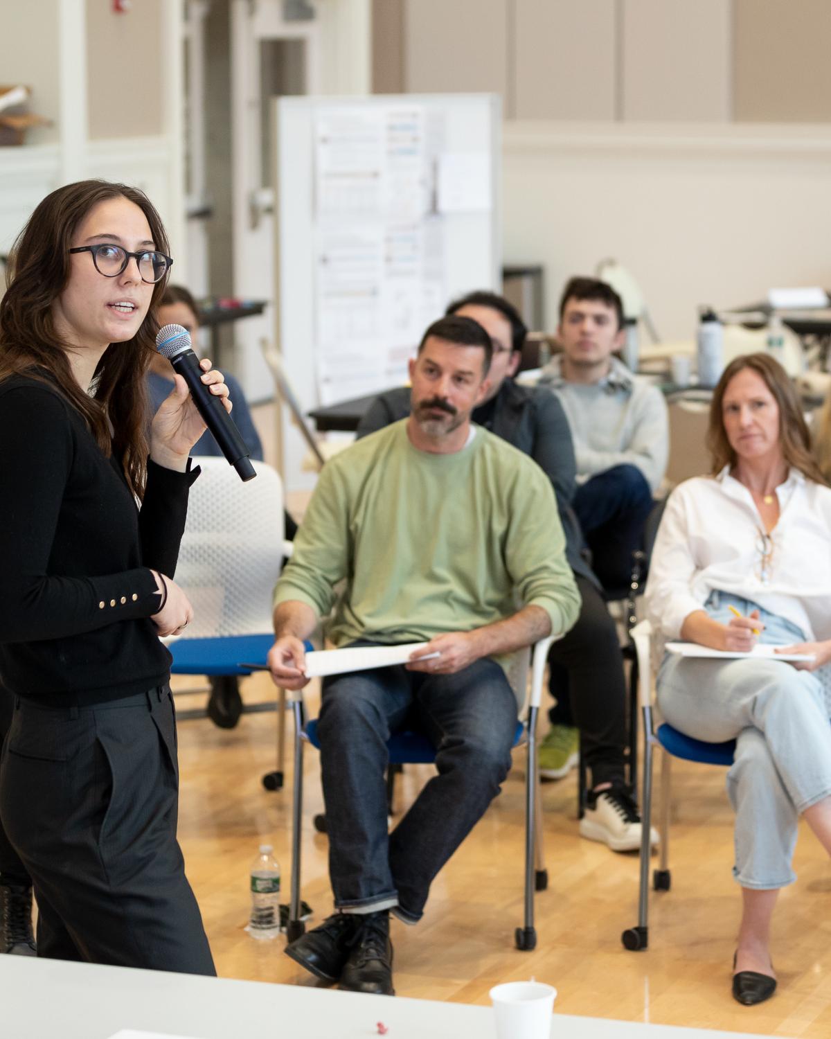 A student presents to MillerKnoll staff in an innovatino challenge. 