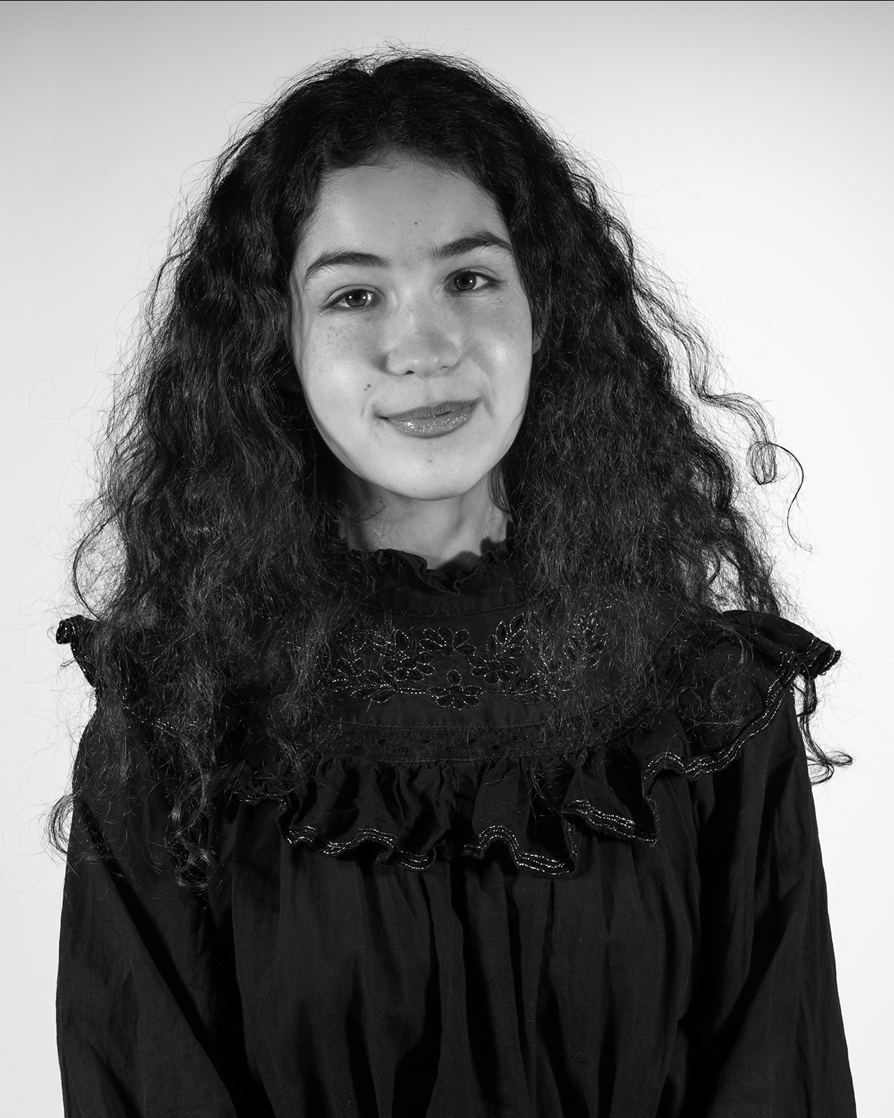 portrait of a young woman with long wavy hair