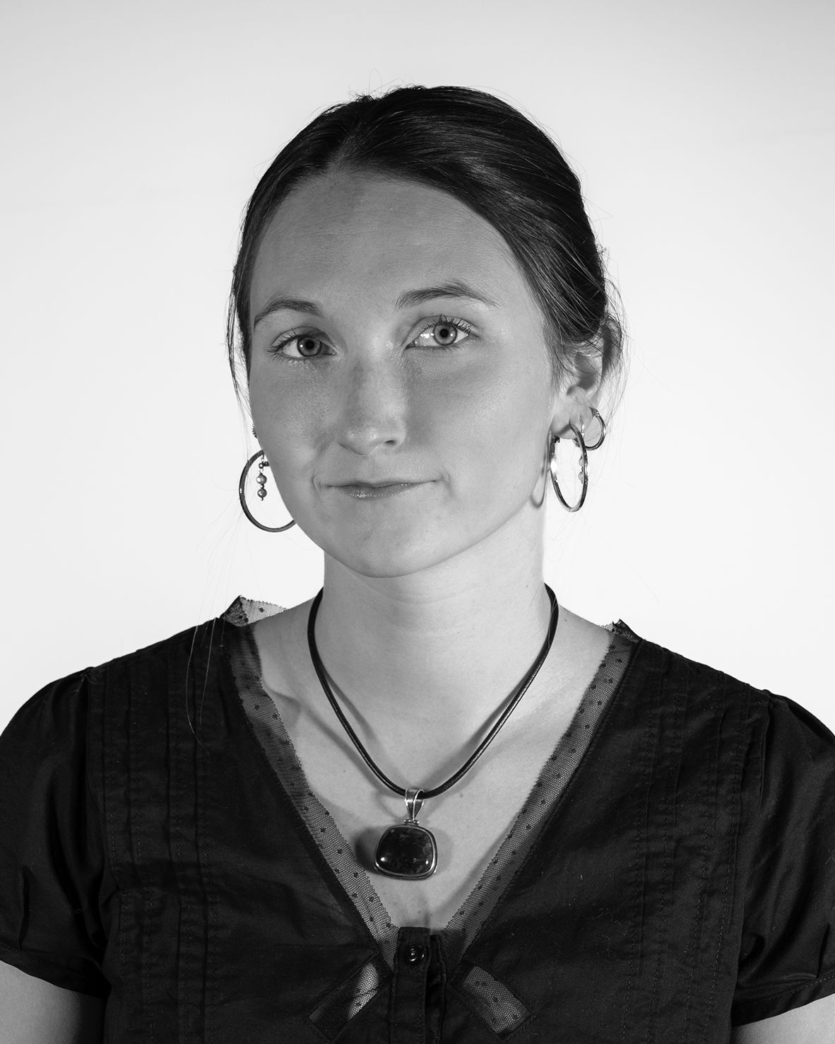portrait of a young woman wearing hoop earrings