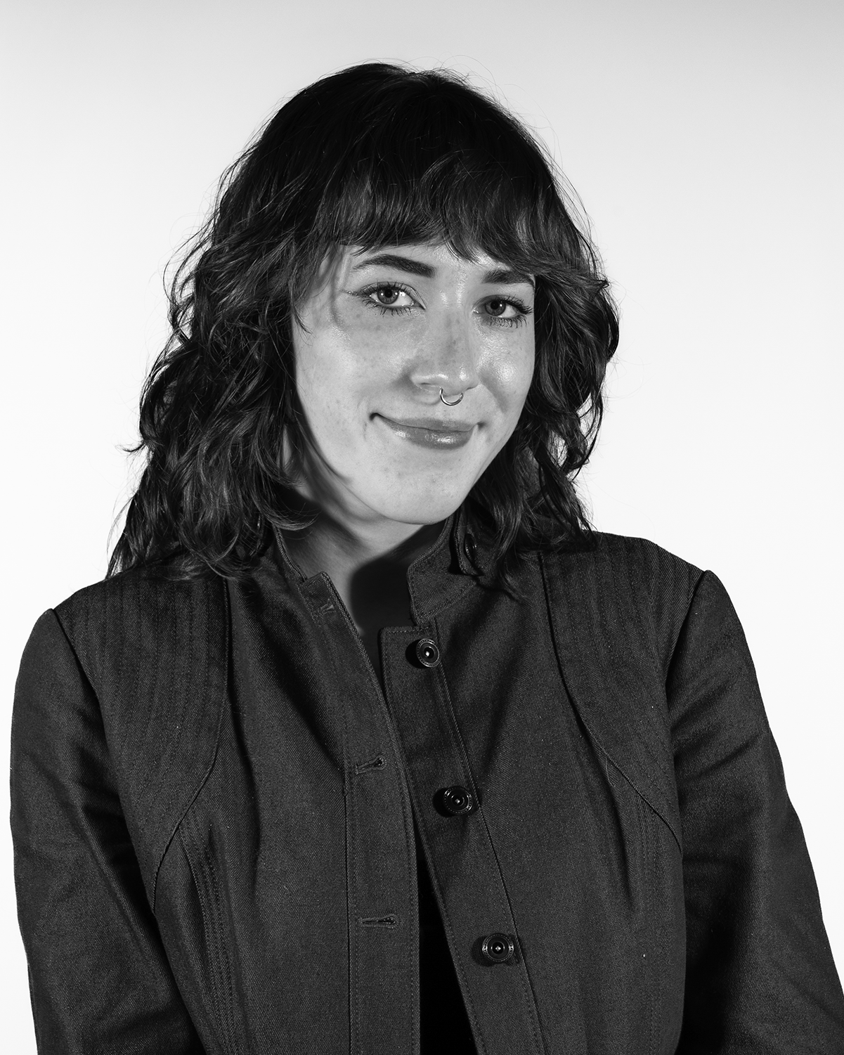 portrait of a person in a black button down shirt