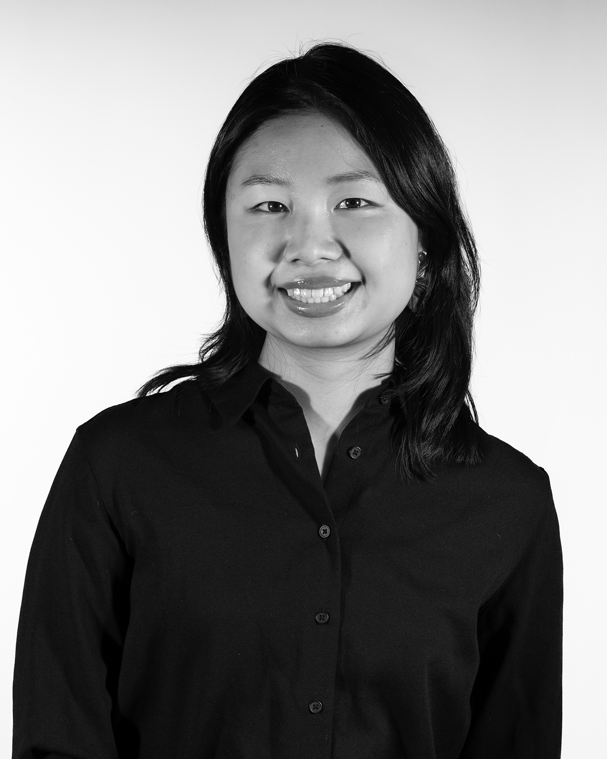 smiling person in a black shirt