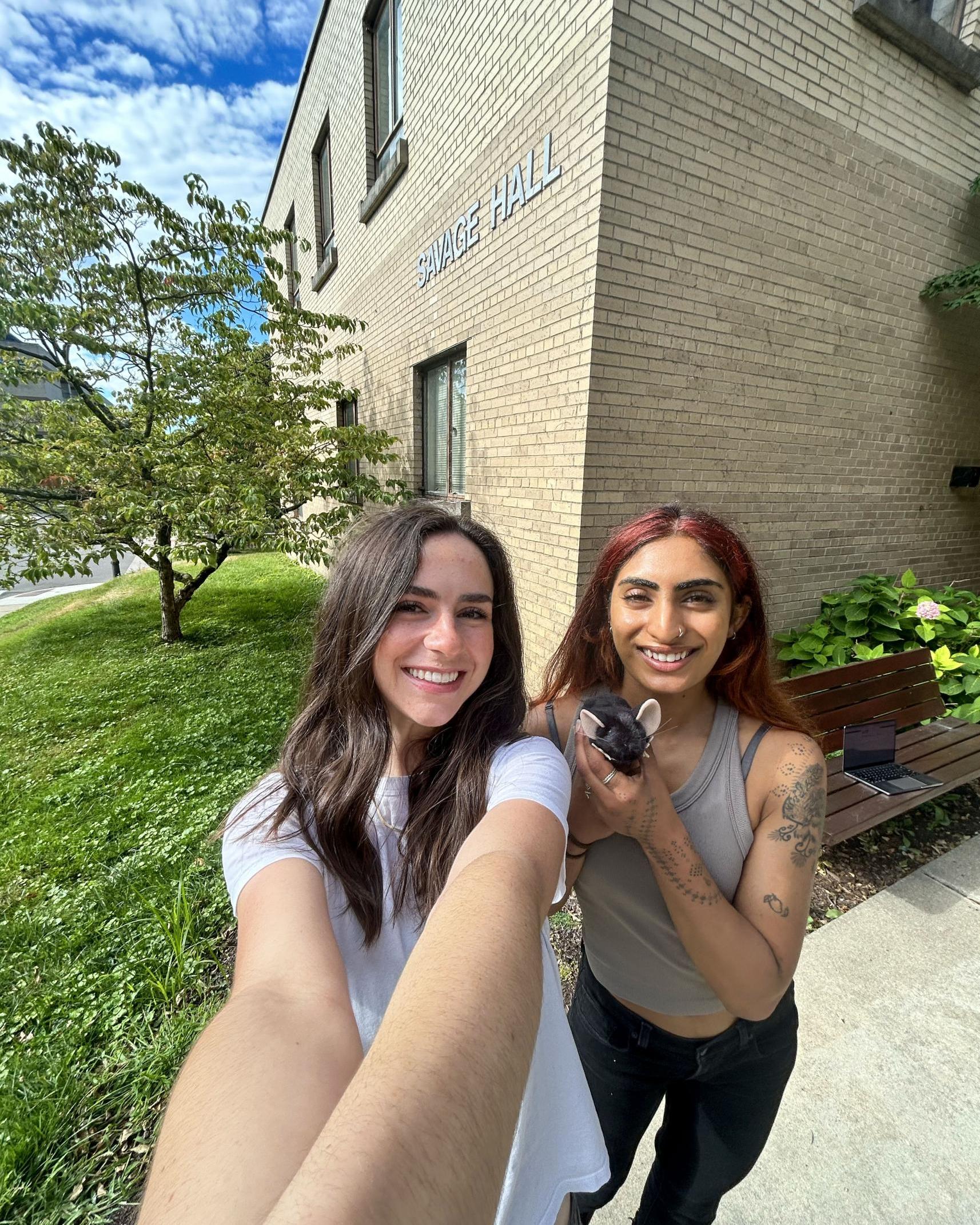 Abby Glick with a labmate in front of Savage Hall