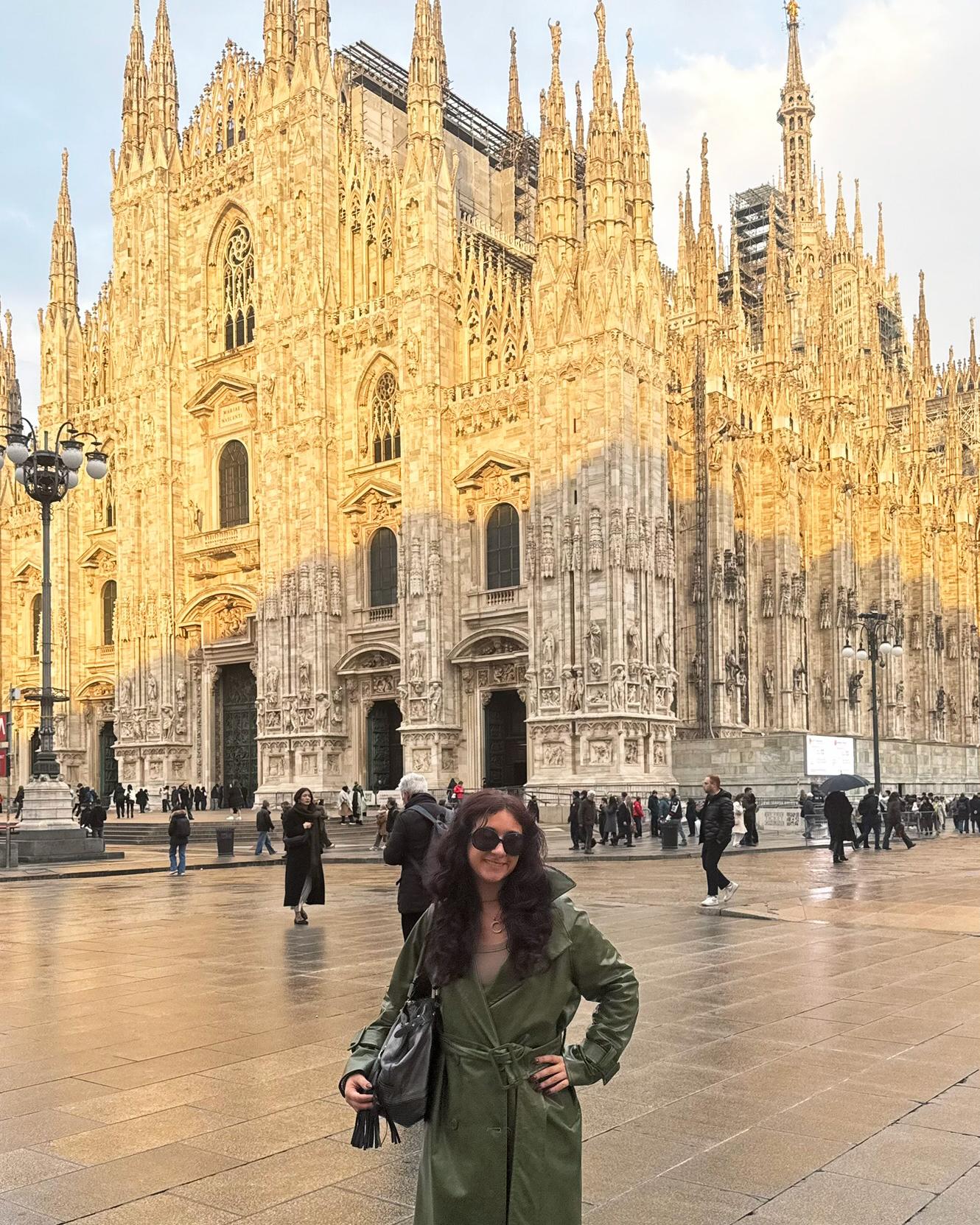 Jess Argan poses in front of the Duomo in Milan, Italy