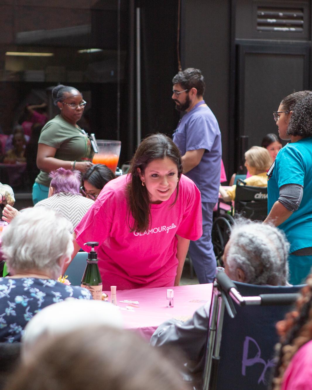 Students helping seniors at an event