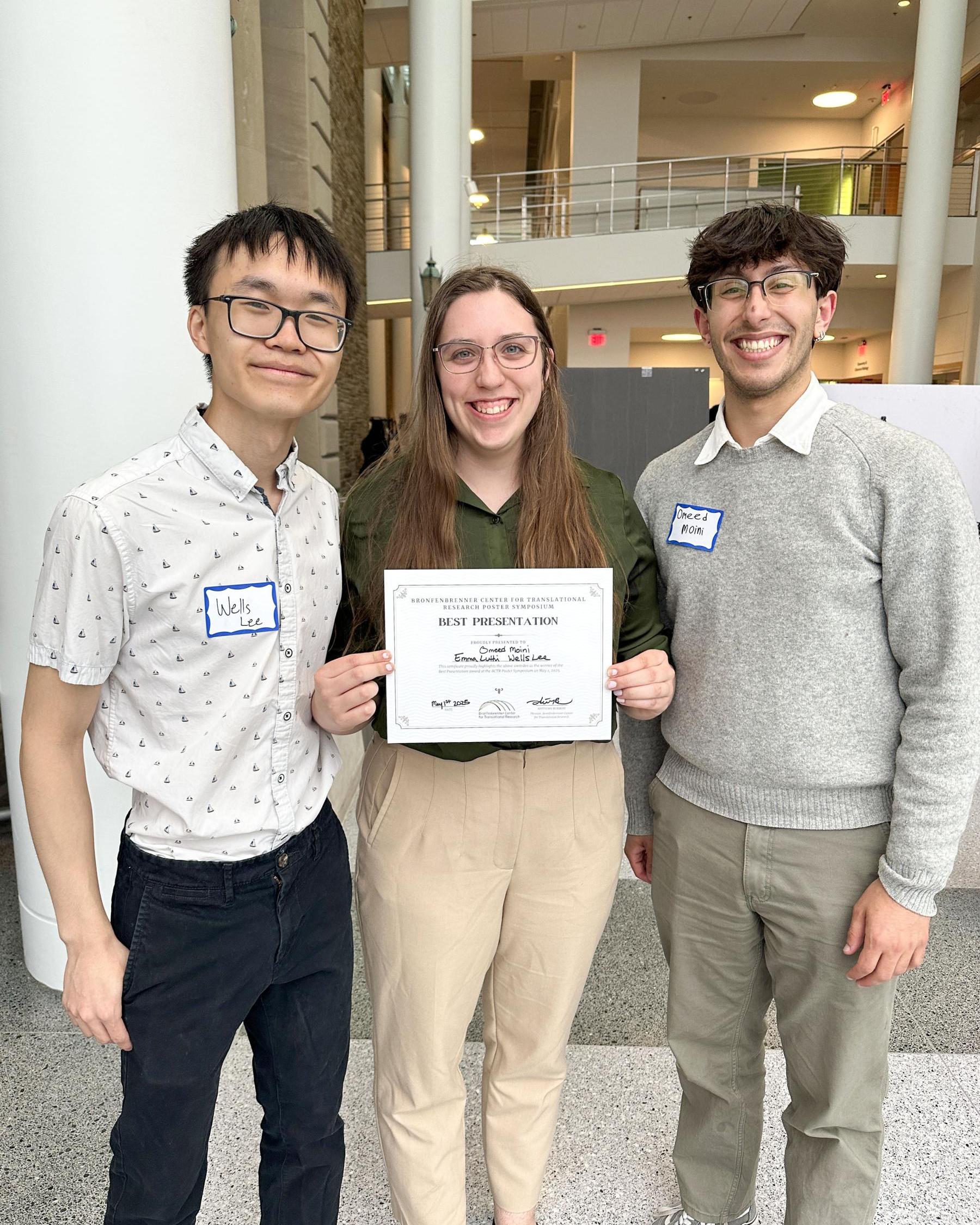 Wells Lee winning best presentation at the BCTR symposium alongside members of his lab
