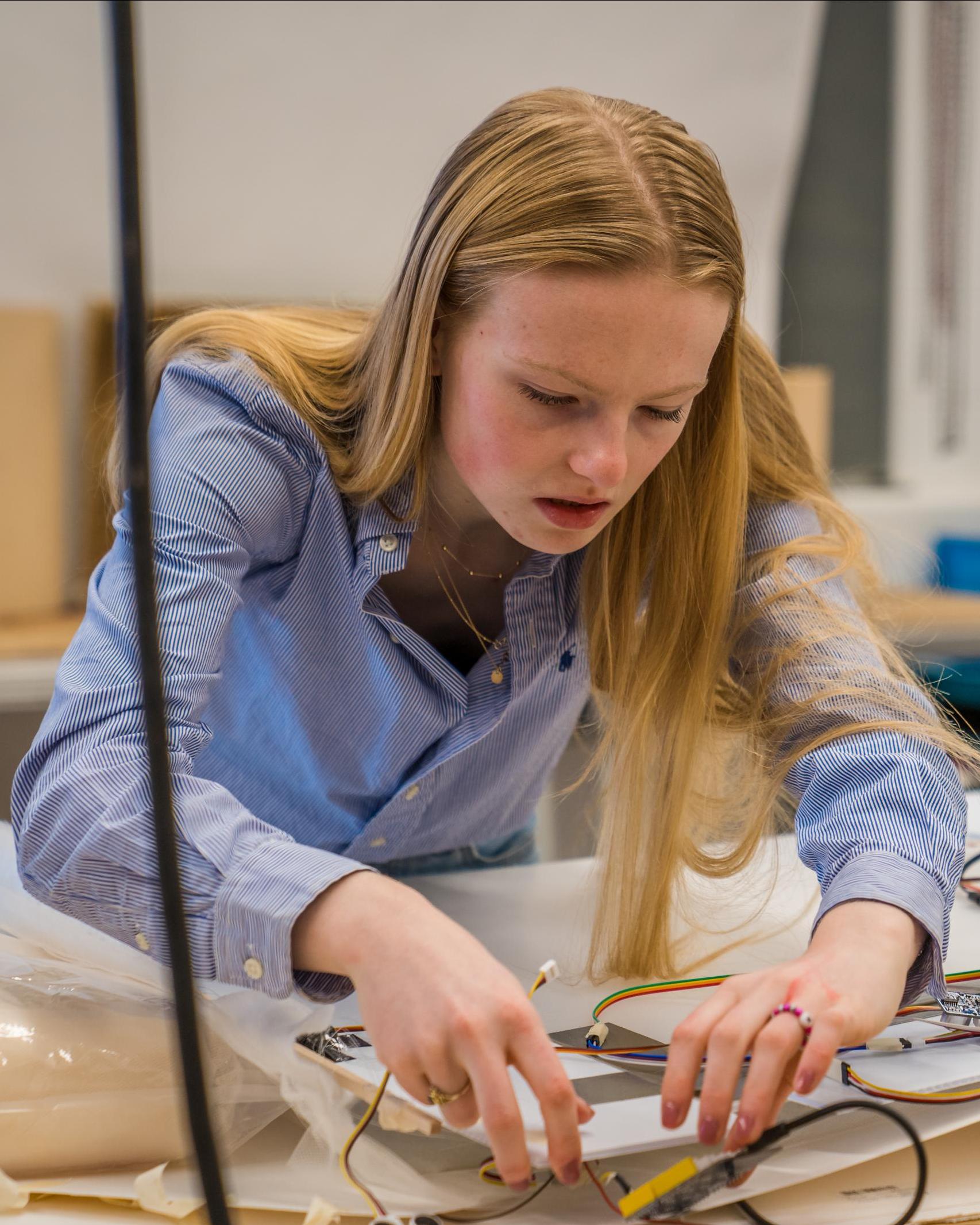 A student works on a proptotype