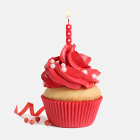 cupcake with red frosting and a red candle