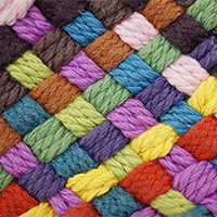 criss-crossed weaving of different colored yarns