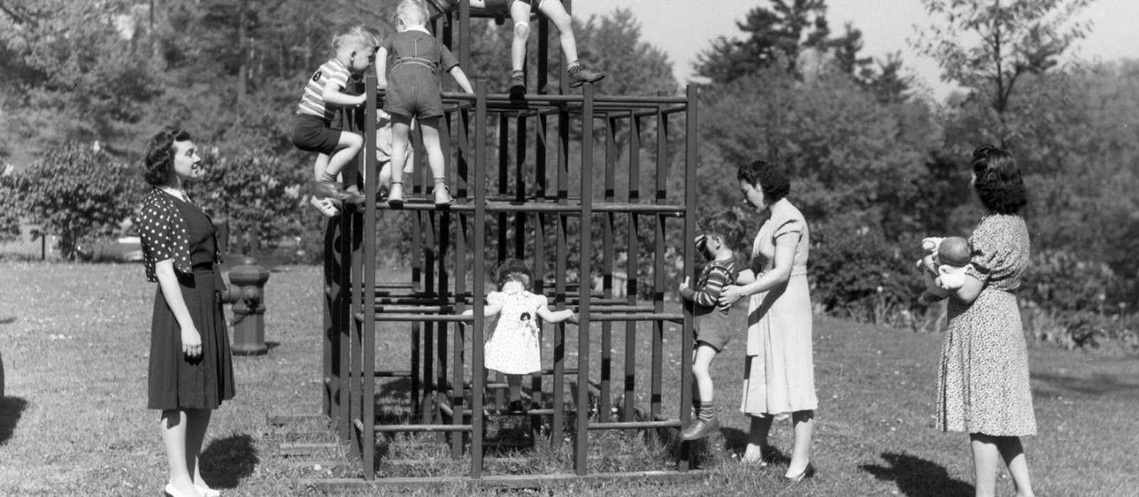 1940s women with children on a jungle gym