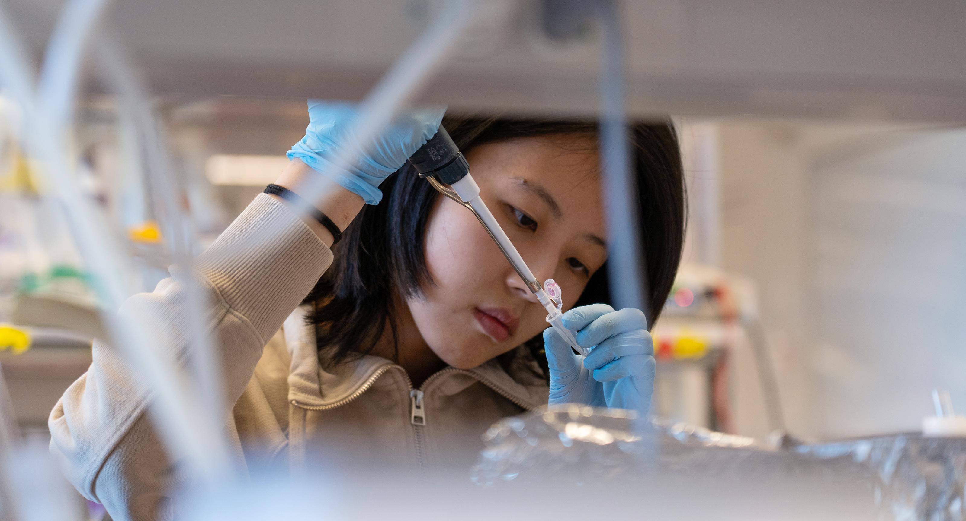 nutrition graduate student working in a lab