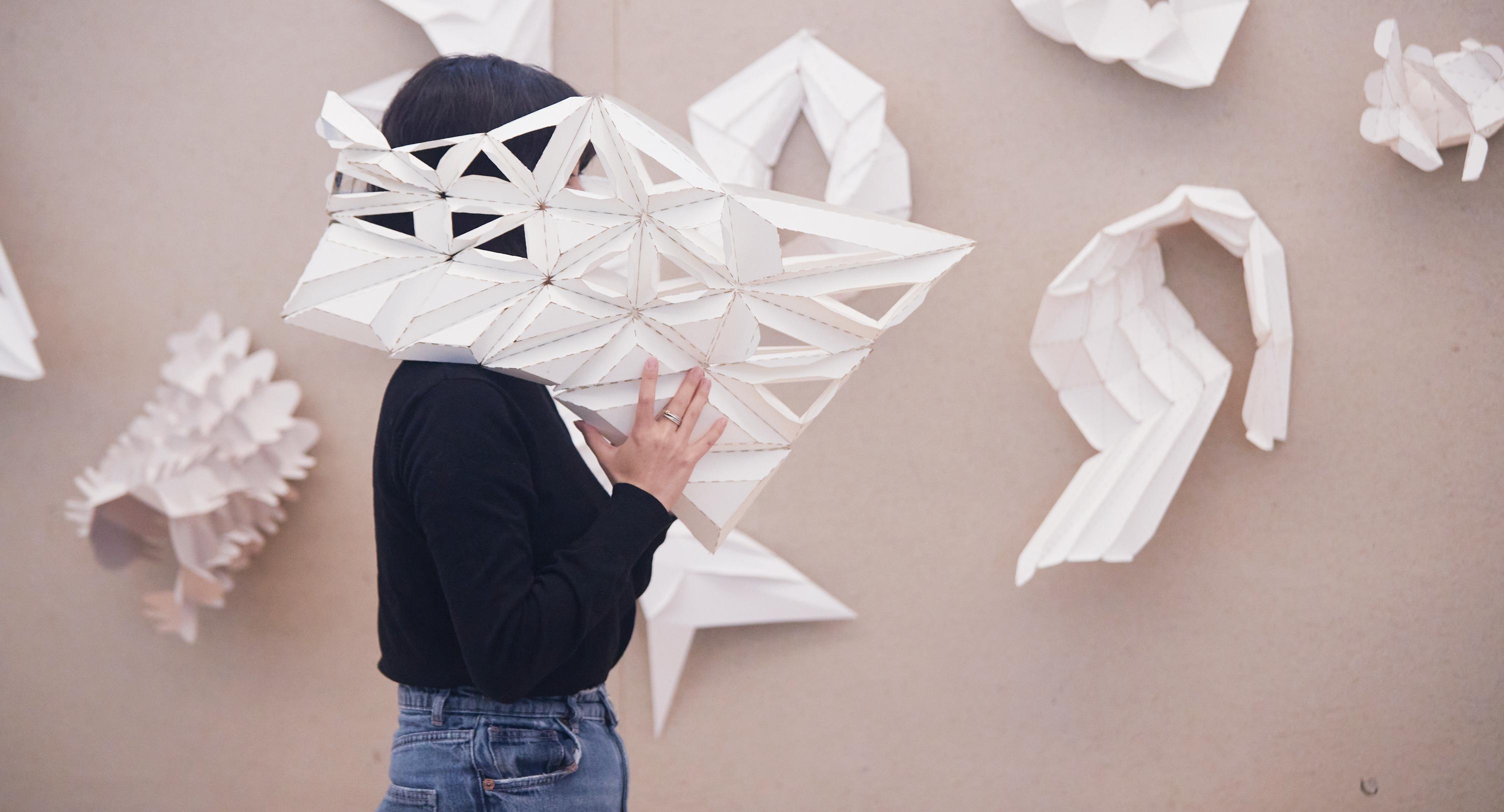 college student with a large constructed headpiece on