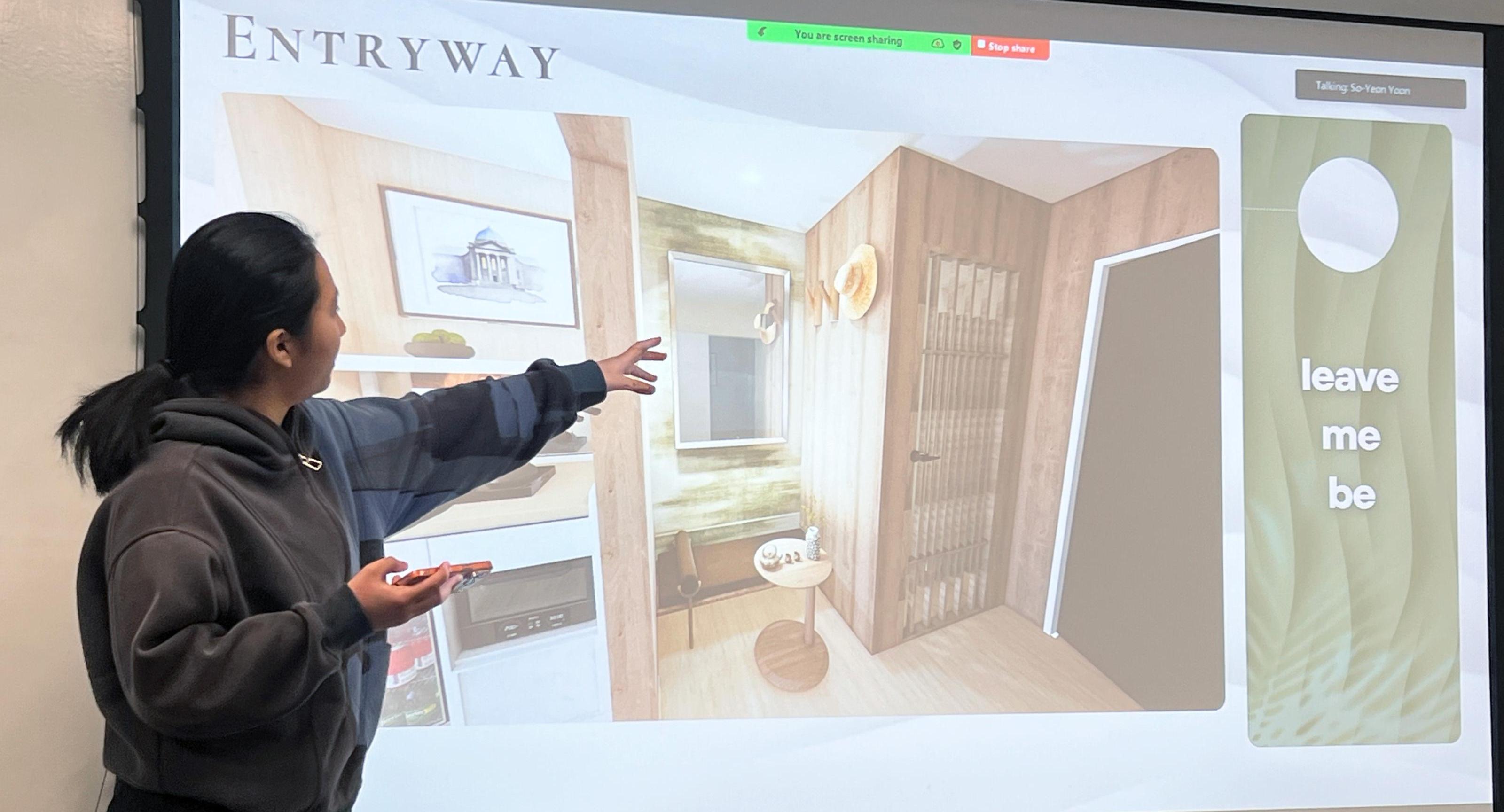a student presents hotel room renderings